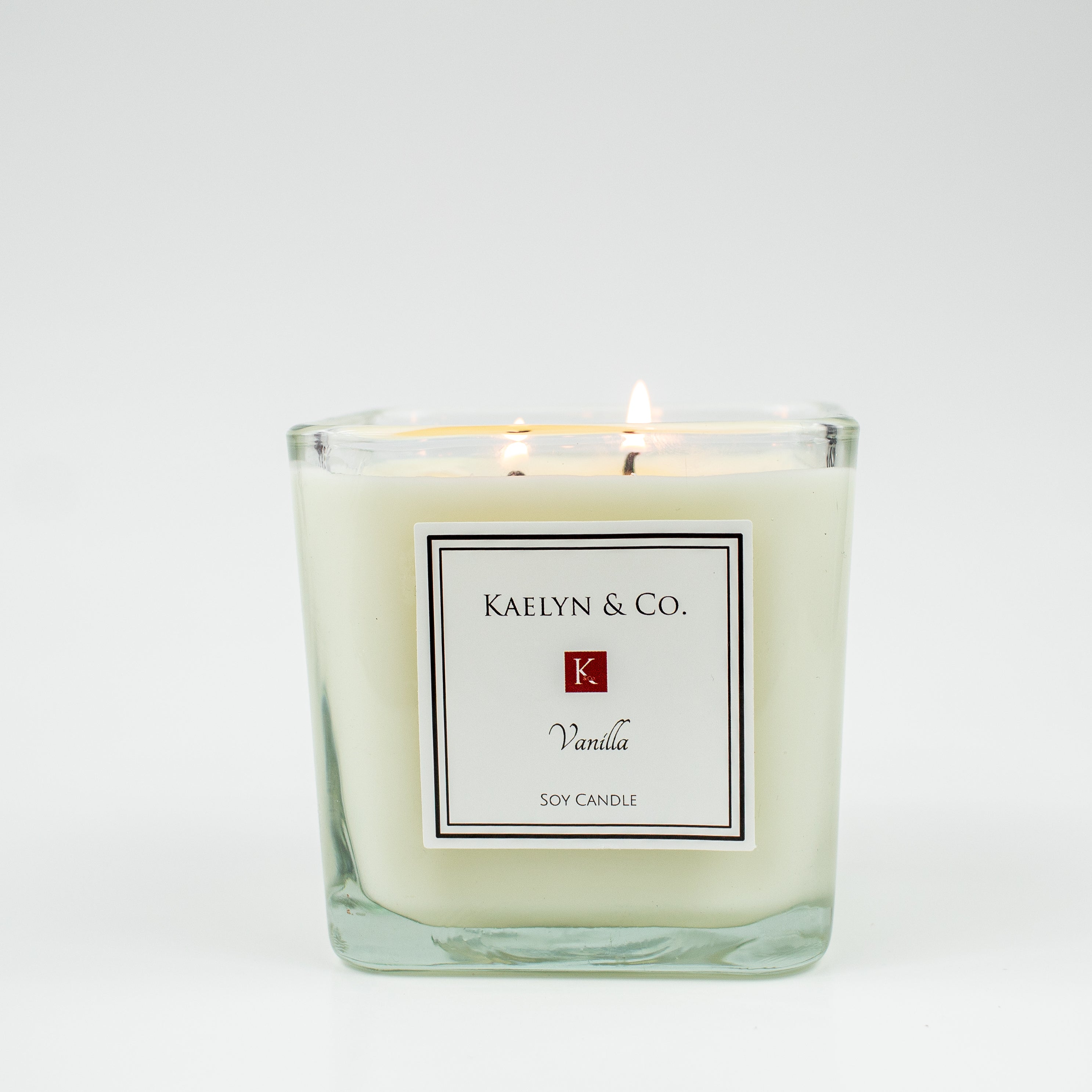 A beautifully crafted Vanilla Medium Cube Candle, hand poured with natural soy wax, featuring a double wick and elegant cube shape.