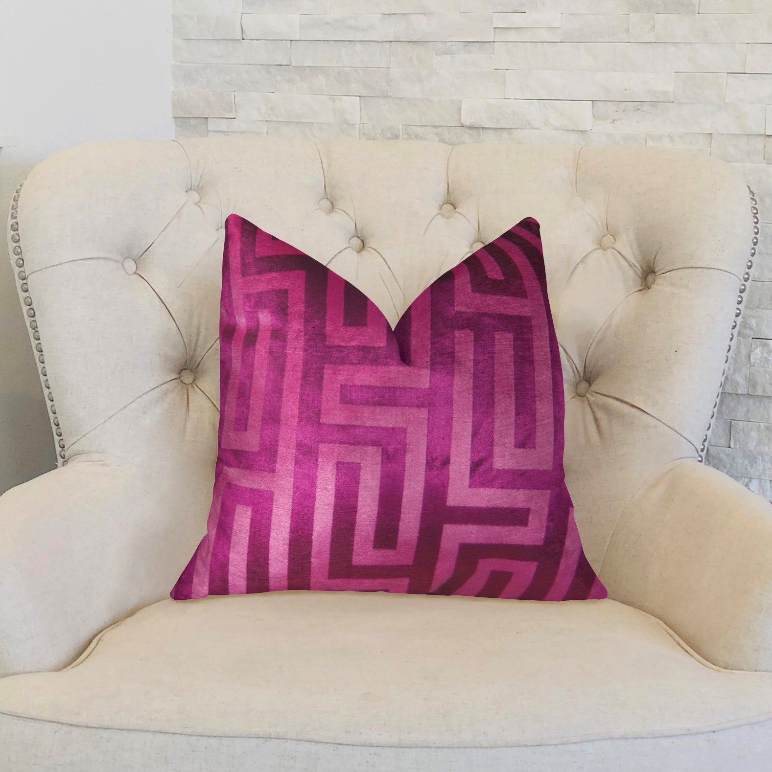 Luxurious fuchsia handmade pillow with geometric pattern and invisible zipper, showcasing vibrant color and soft texture.