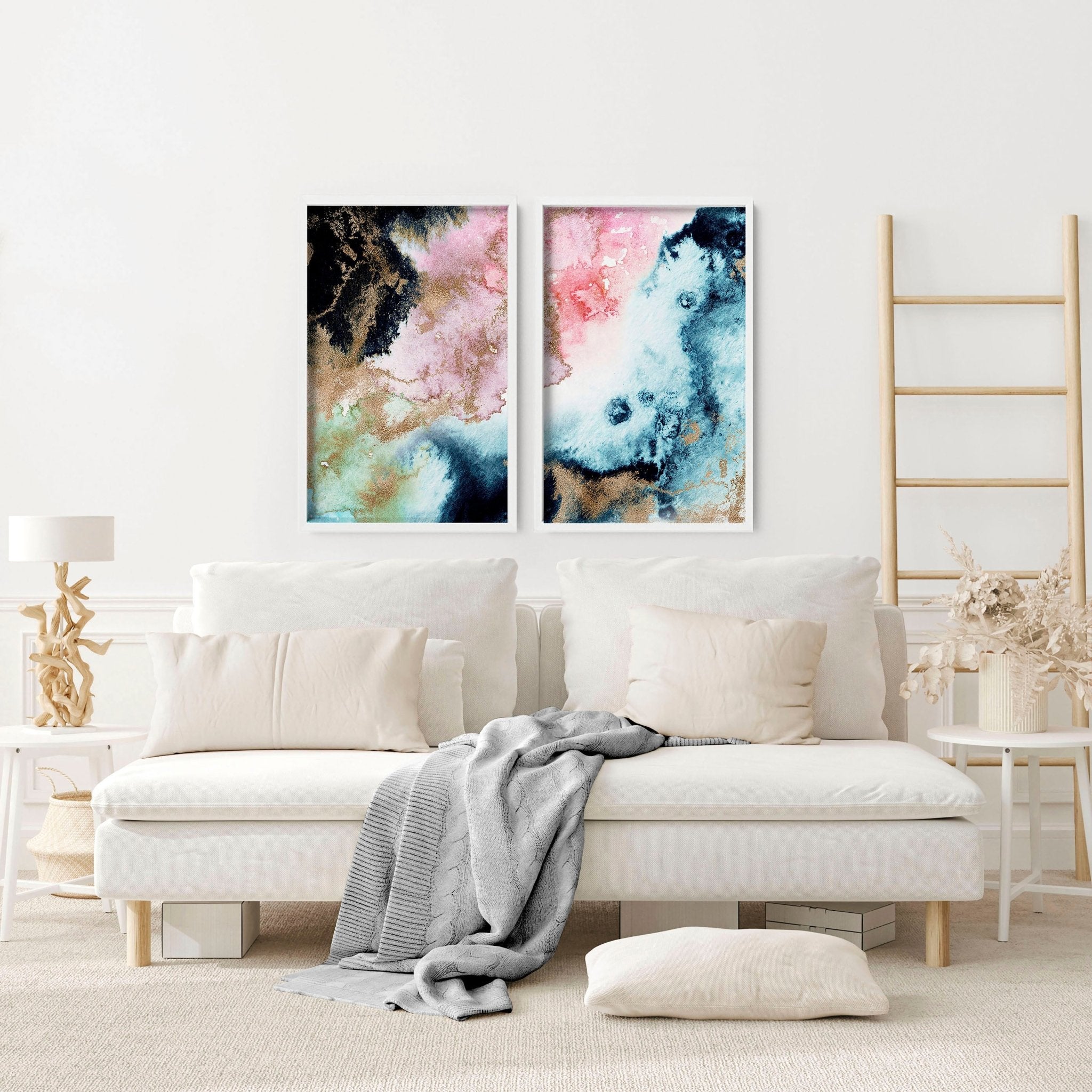 Set of 2 abstract modern wall art prints featuring vibrant alcohol ink marble textures and shimmering gold accents in sleek black frames.