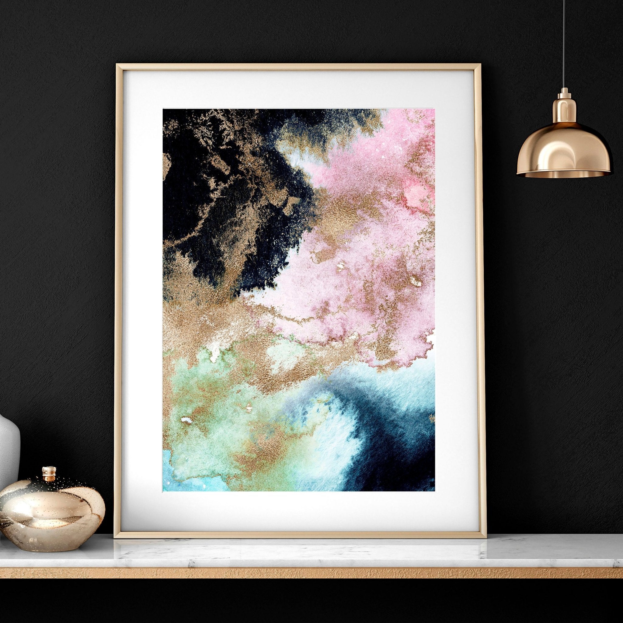 Set of 2 abstract modern wall art prints featuring vibrant alcohol ink marble textures and shimmering gold accents in sleek black frames.