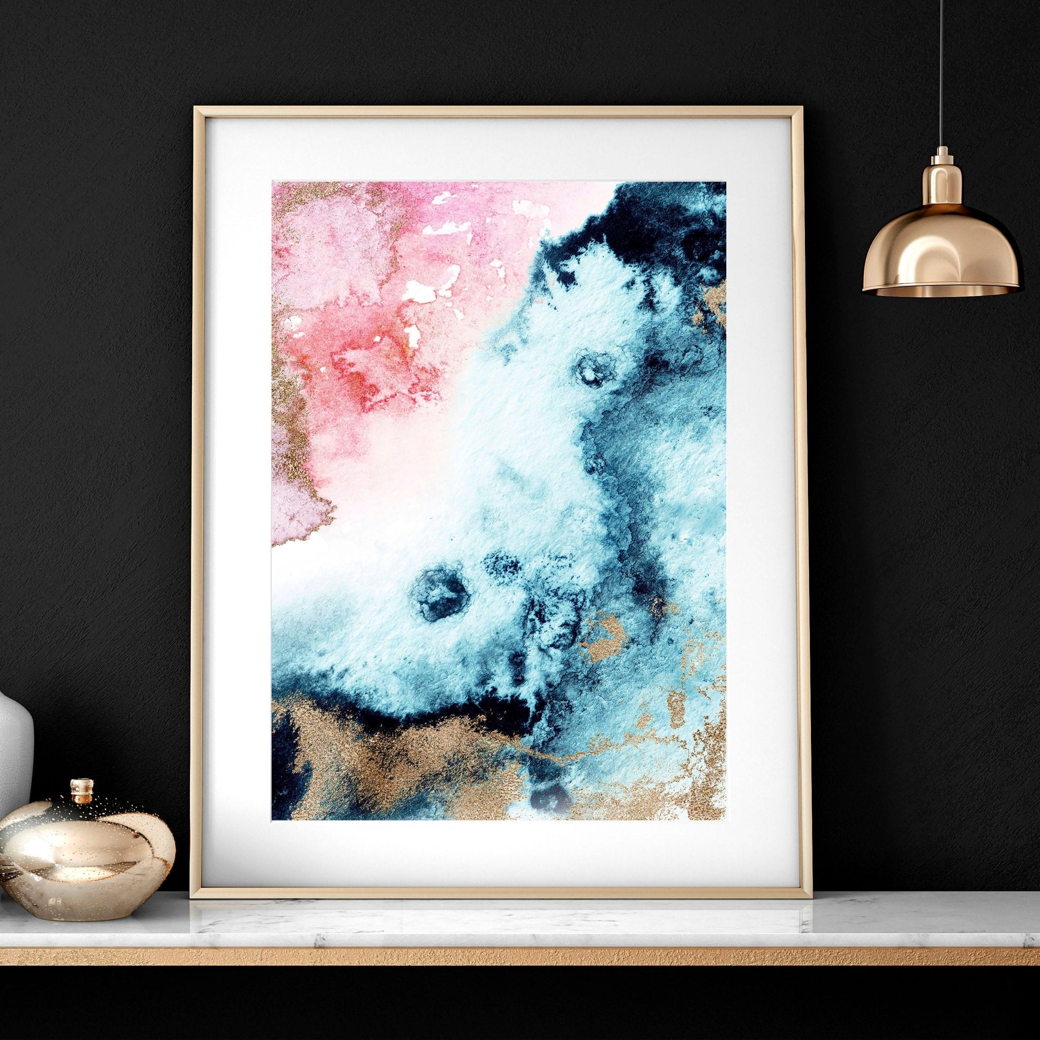 Set of 2 abstract modern wall art prints featuring vibrant alcohol ink marble textures and shimmering gold accents in sleek black frames.