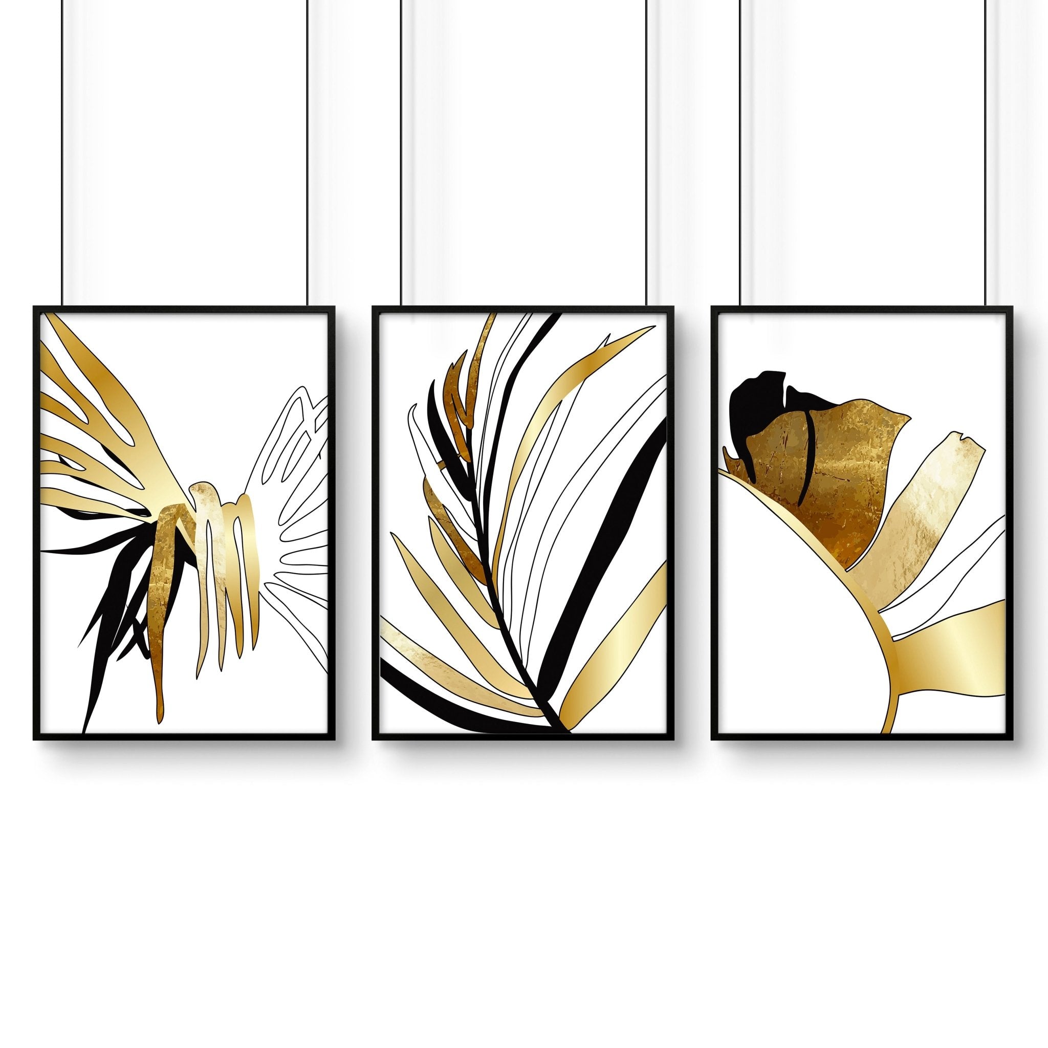 Set of 3 modern tropical wall art prints featuring elegant botanical designs in white, black, and gold, perfect for living room decor.