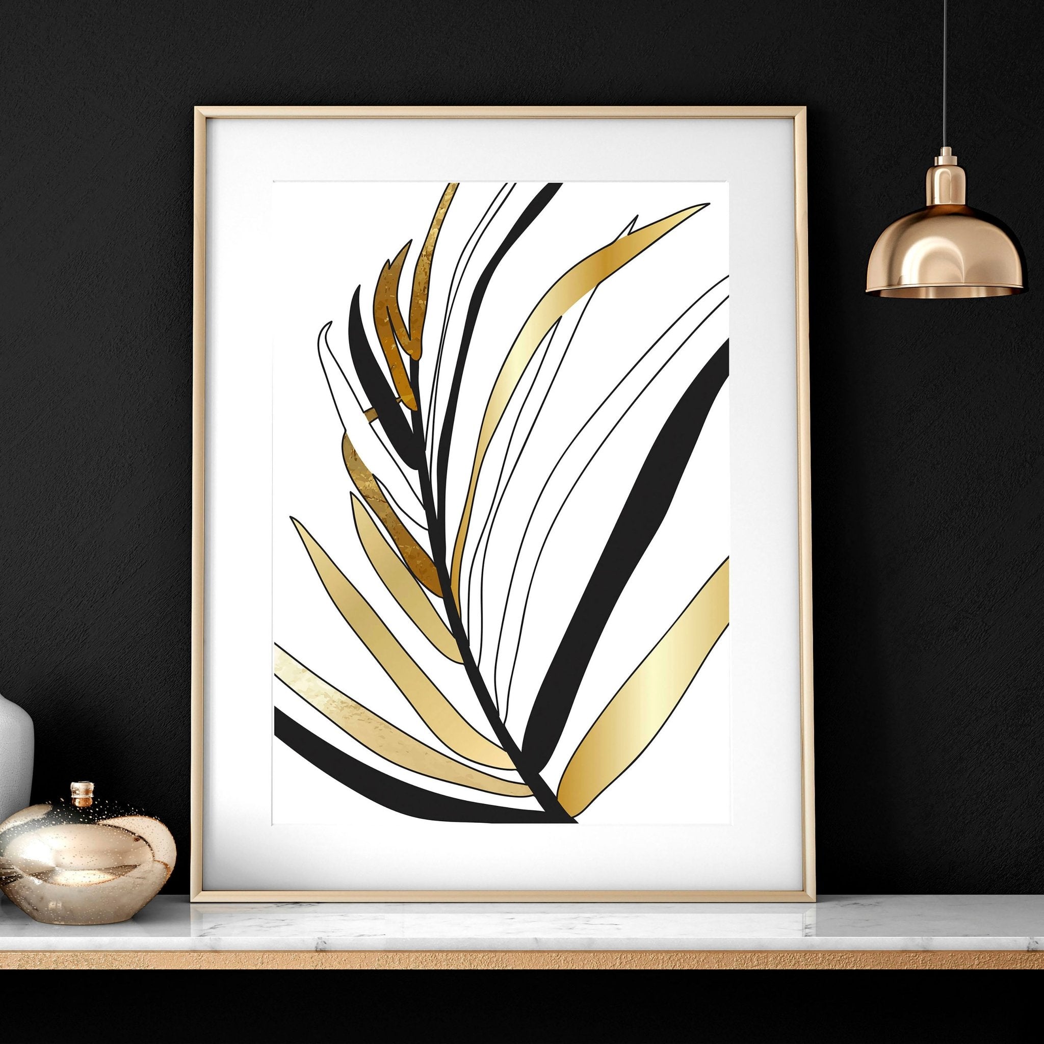 Set of 3 modern tropical wall art prints featuring elegant botanical designs in white, black, and gold, perfect for living room decor.