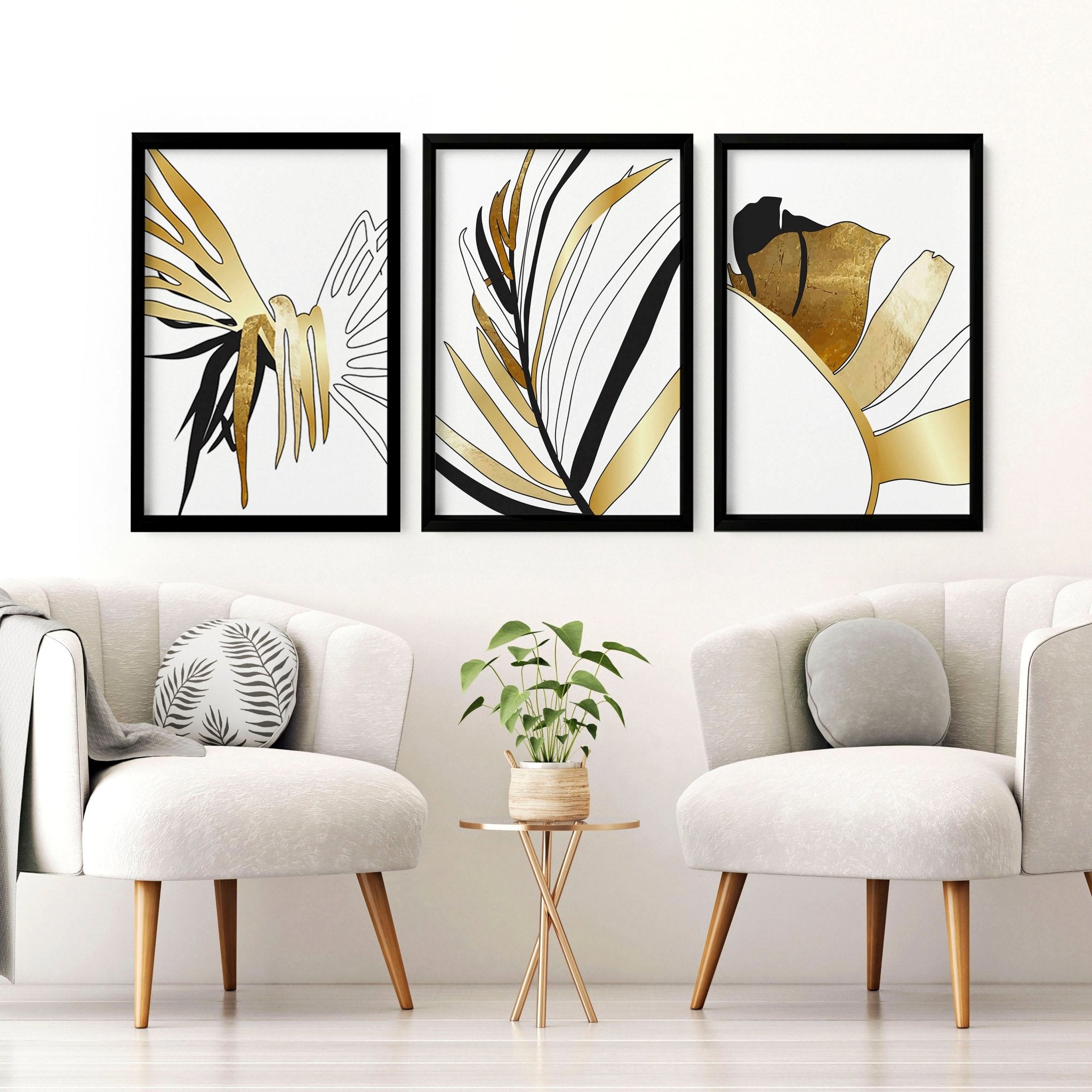 Set of 3 modern tropical wall art prints featuring elegant botanical designs in white, black, and gold, perfect for living room decor.