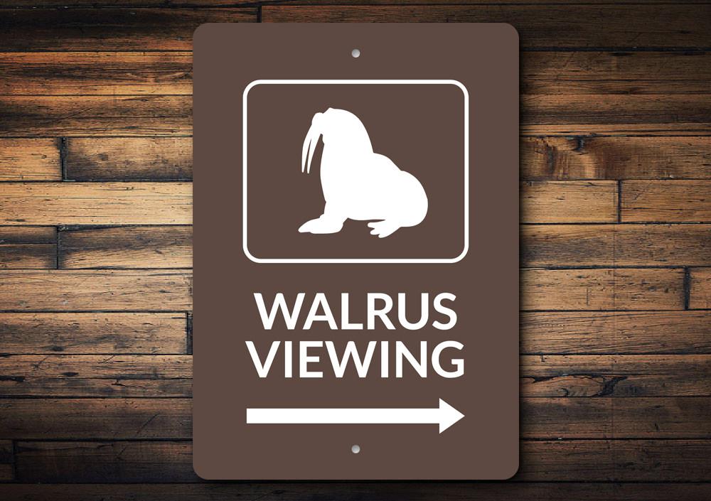 A decorative Walrus Viewing Sign made of aluminum, featuring a whimsical design perfect for beach-themed decor.