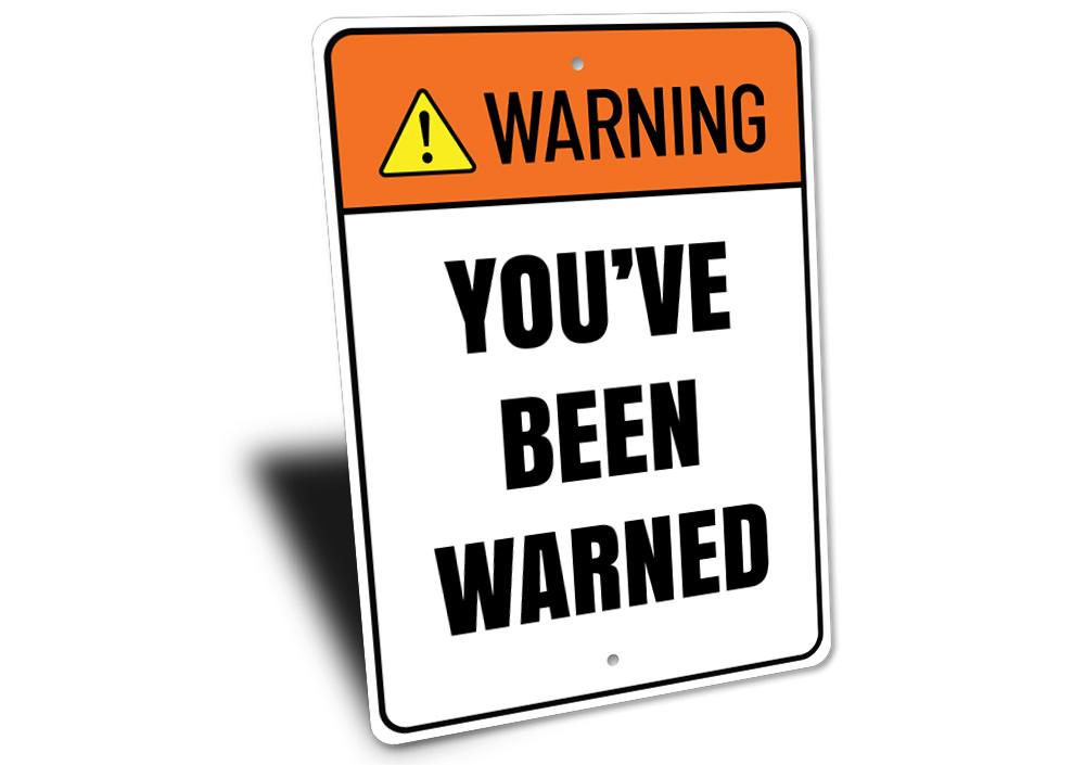 A decorative 'Warning You've Been Warned' sign made of high-quality aluminum, featuring bold lettering and a stylish design, perfect for home decor.