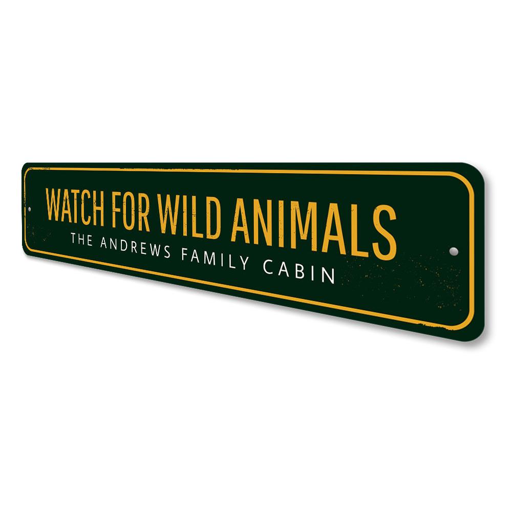 A decorative 'Watch For Wild Animals' sign made of durable aluminum, featuring customizable text, ideal for lakehouse decor.