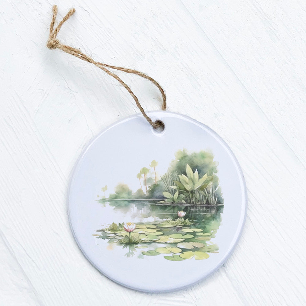 A beautifully crafted porcelain ornament featuring a vibrant water lily design, showcasing its smooth glossy finish.