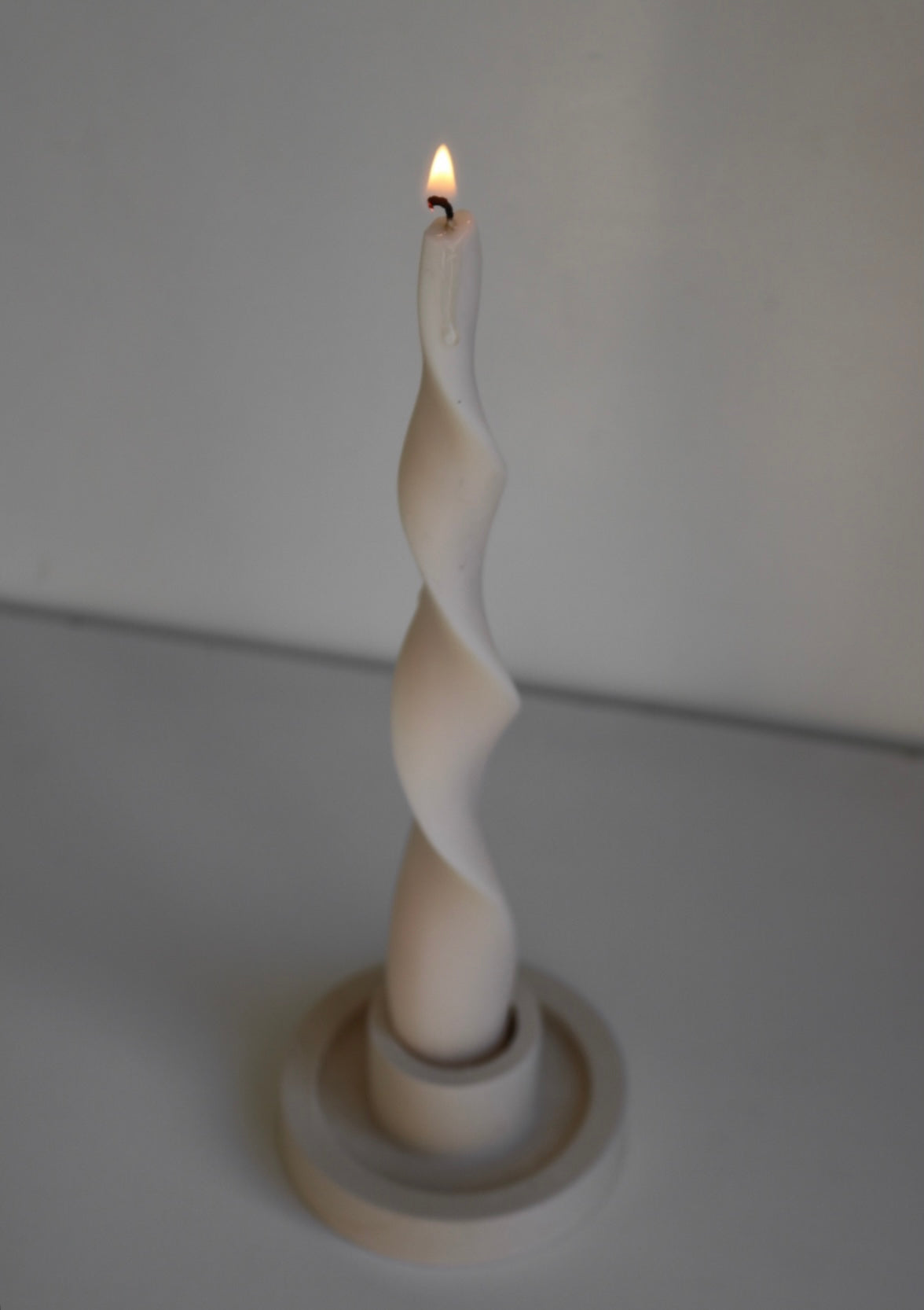 Elegant wave candlestick made from soy wax blend, showcasing a sculptural design perfect for home decor.