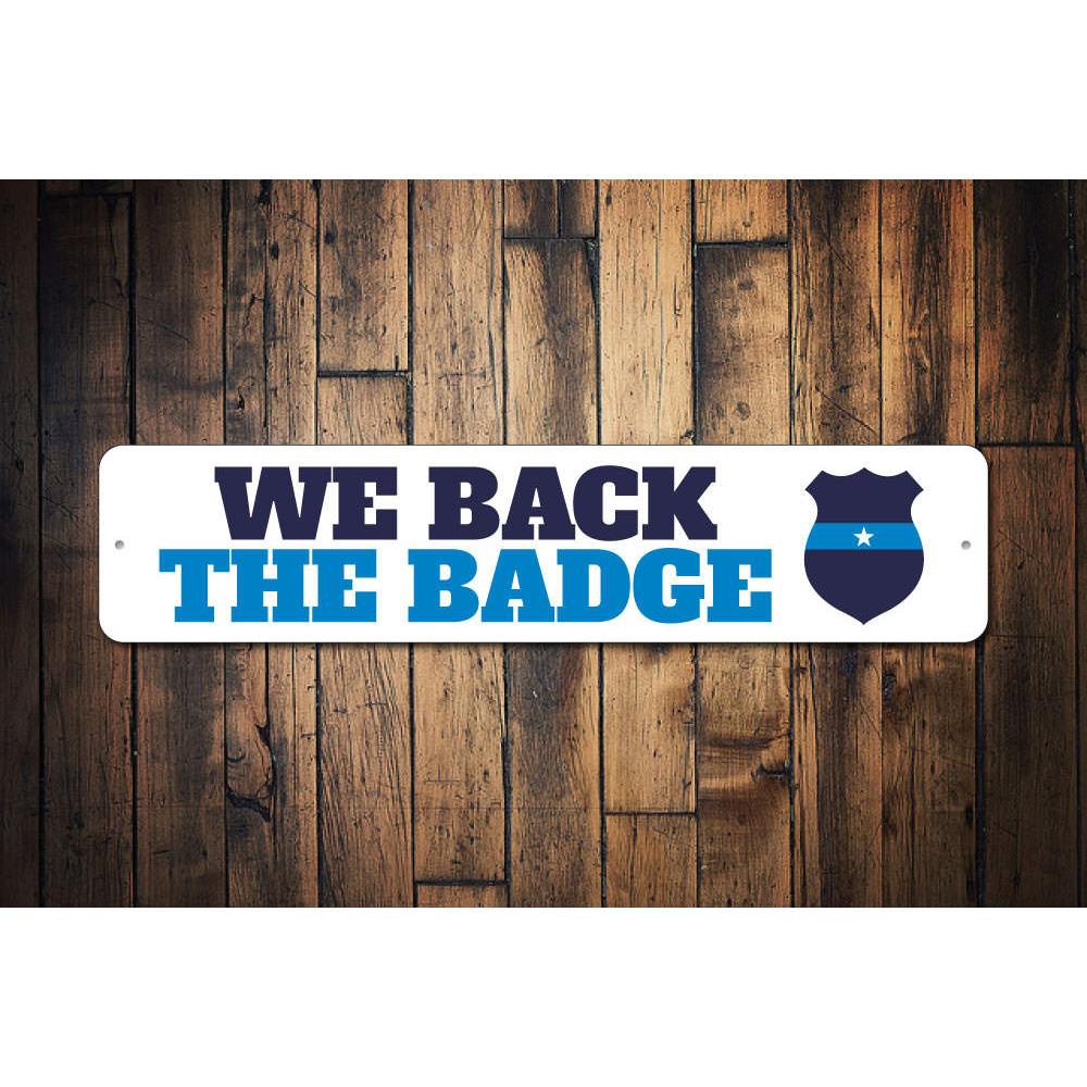 We Back the Badge Sign made of high-quality aluminum, featuring a bold design suitable for indoor and outdoor decor.