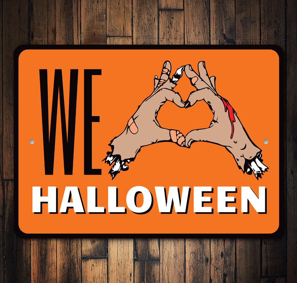 We Love Halloween Sign made of durable aluminum, featuring spooky design elements perfect for Halloween decor.