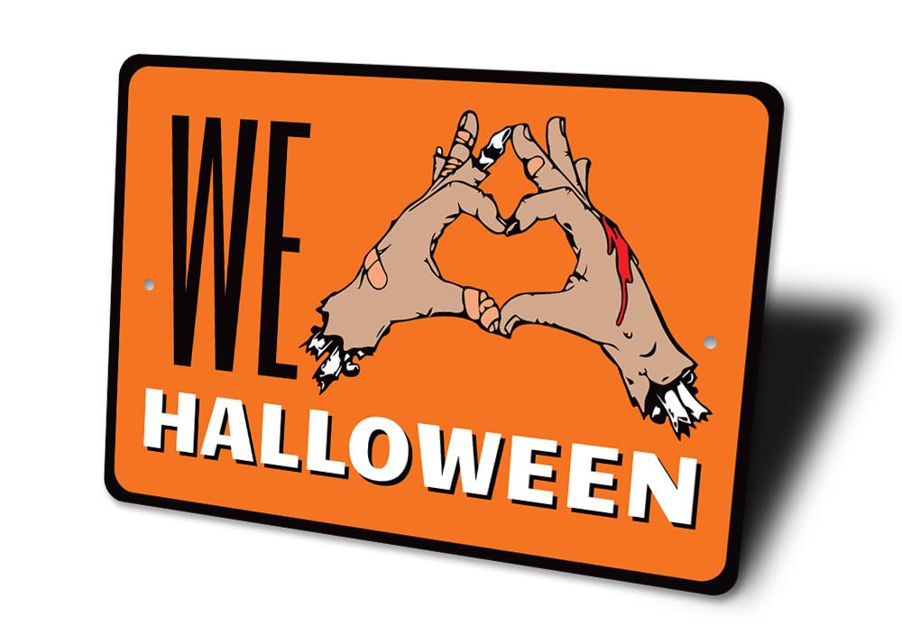 We Love Halloween Sign made of durable aluminum, featuring spooky design elements perfect for Halloween decor.