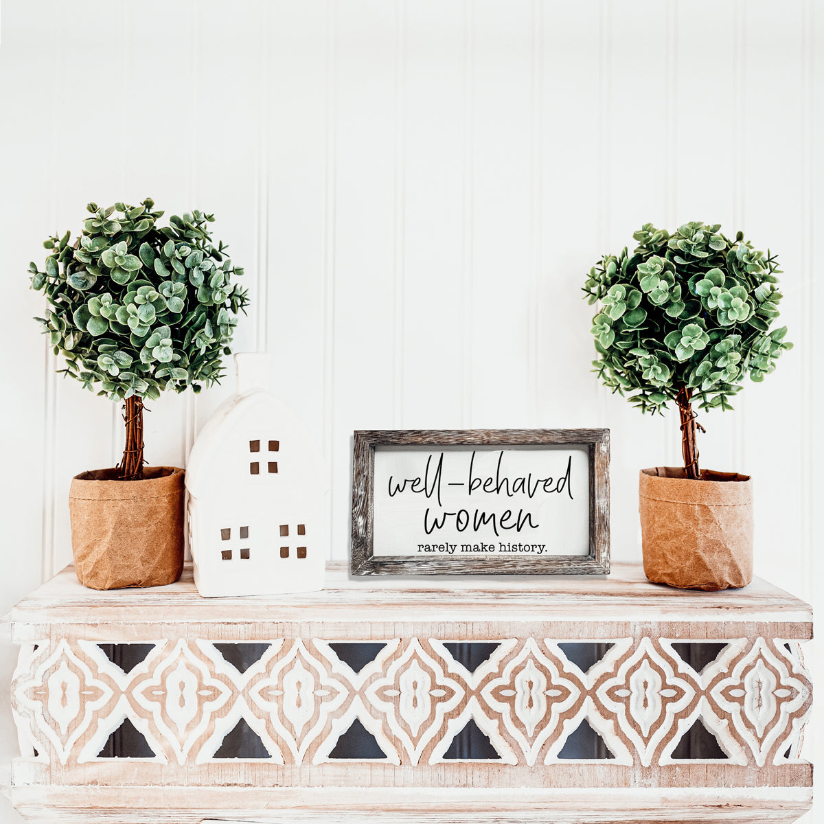 Well Behaved Women Sign made of durable Paulownia wood, featuring a stylish wooden frame with an empowering message.