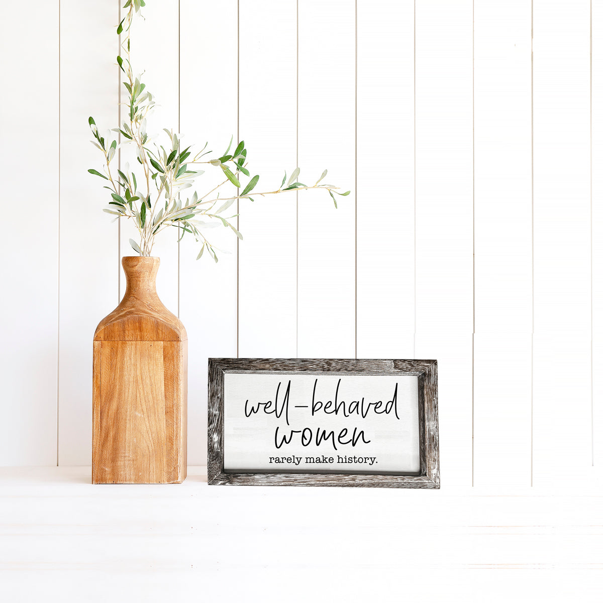 Well Behaved Women Sign made of durable Paulownia wood, featuring a stylish wooden frame with an empowering message.