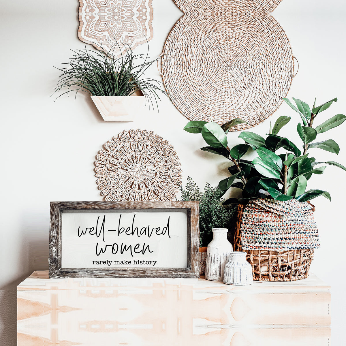 Well Behaved Women Sign made of durable Paulownia wood, featuring a stylish wooden frame with an empowering message.