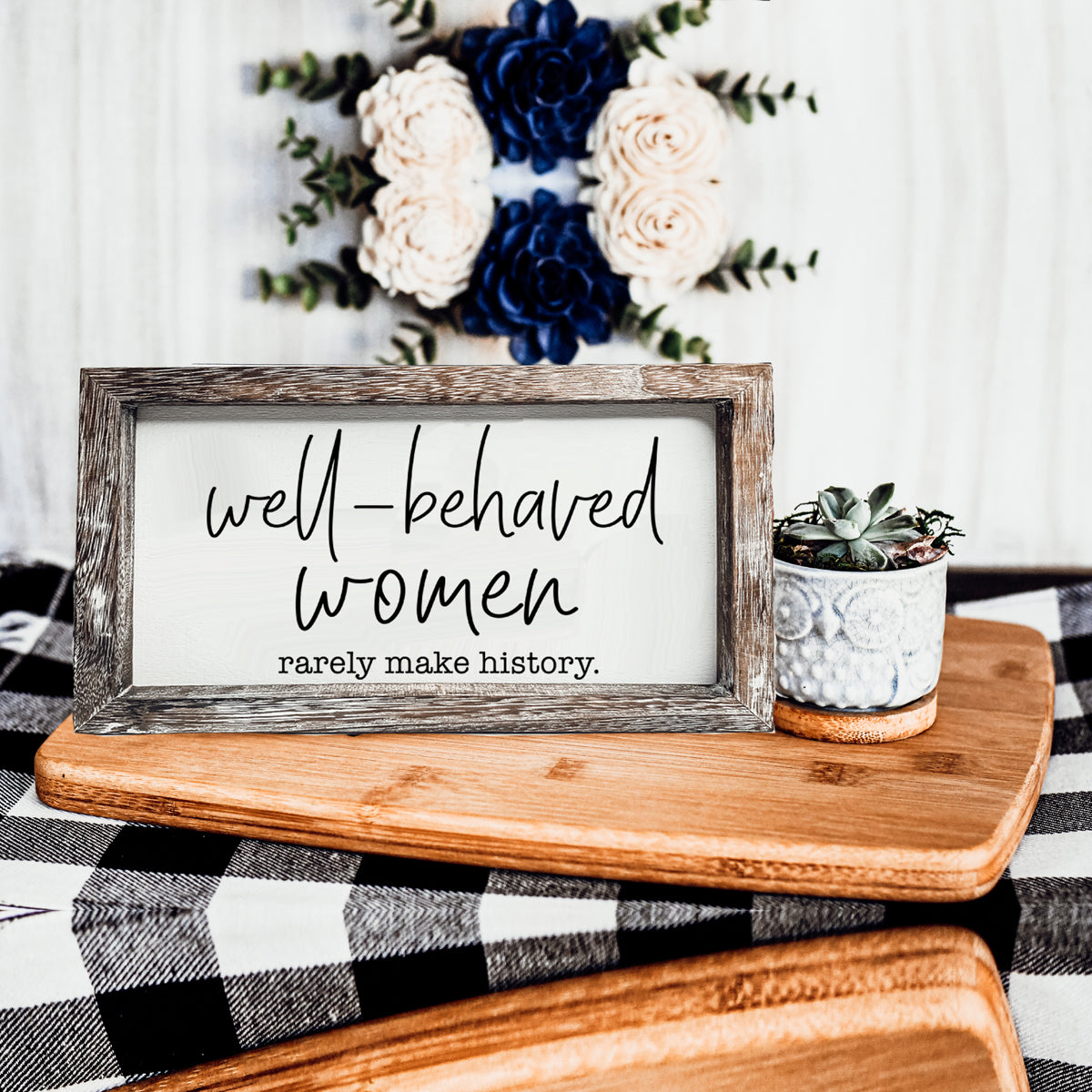 Well Behaved Women Sign made of durable Paulownia wood, featuring a stylish wooden frame with an empowering message.