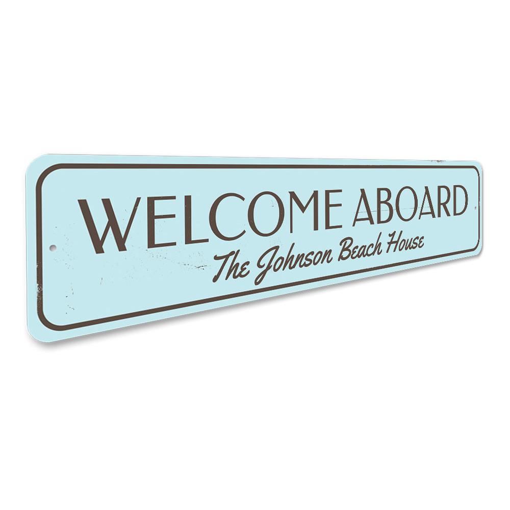 Welcome Aboard Beach House Sign made of durable aluminum, featuring customizable text and pre-drilled holes for easy mounting.