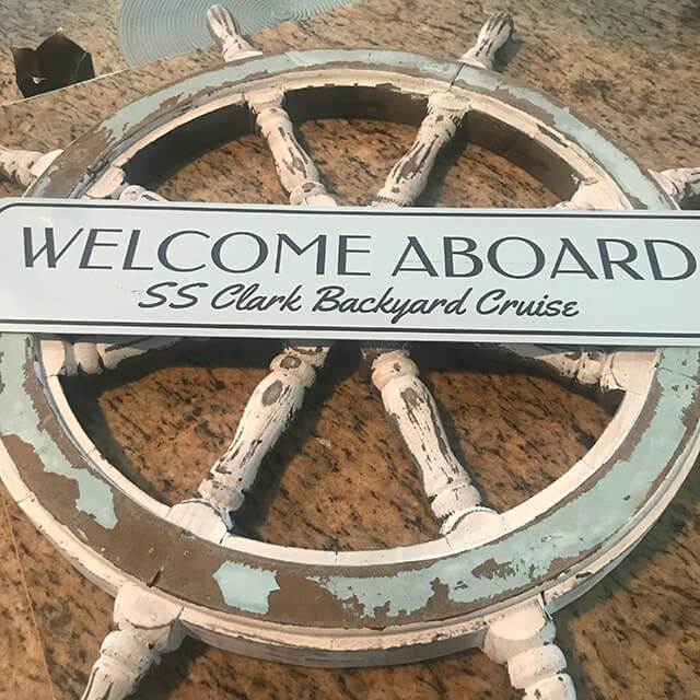 Welcome Aboard Beach House Sign made of durable aluminum, featuring customizable text and pre-drilled holes for easy mounting.