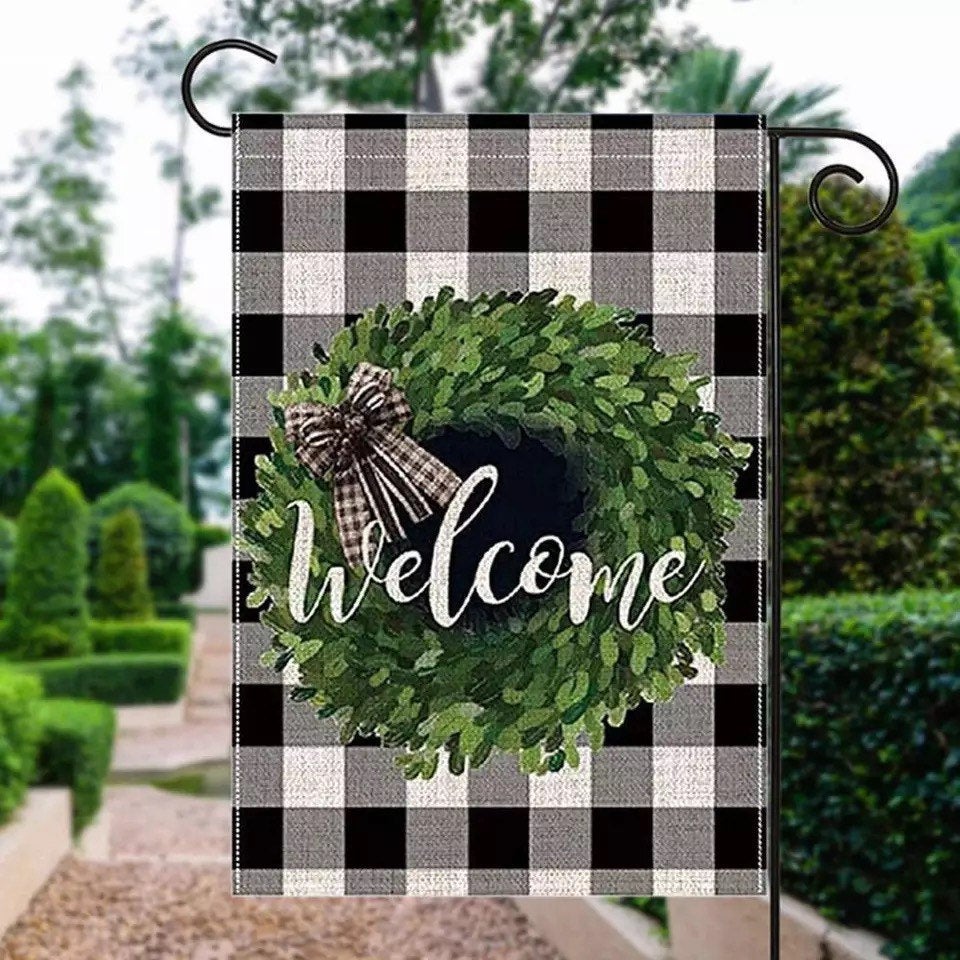 A vibrant Welcome Garden flag measuring 12.5x18 inches, featuring a welcoming design printed on both sides, perfect for outdoor decor.