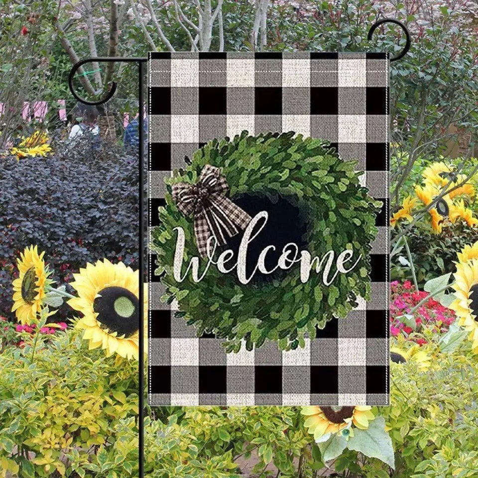 A vibrant Welcome Garden flag measuring 12.5x18 inches, featuring a welcoming design printed on both sides, perfect for outdoor decor.