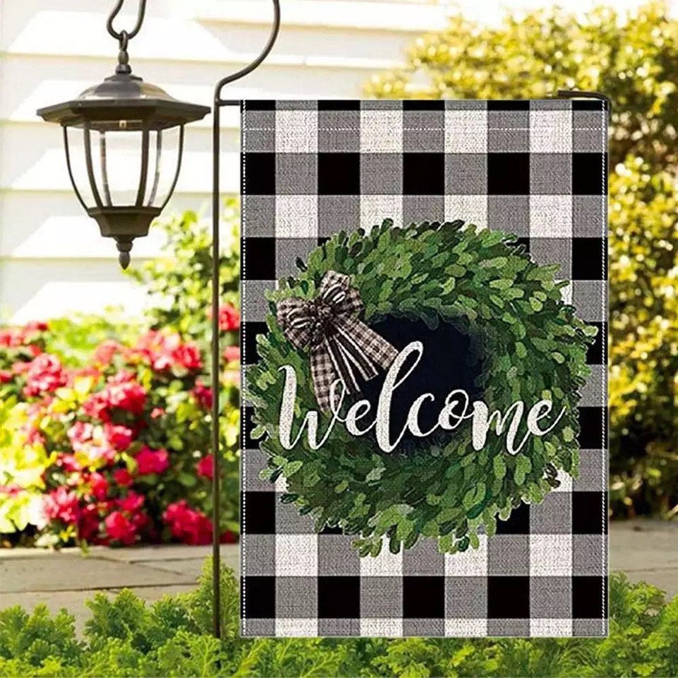 A vibrant Welcome Garden flag measuring 12.5x18 inches, featuring a welcoming design printed on both sides, perfect for outdoor decor.