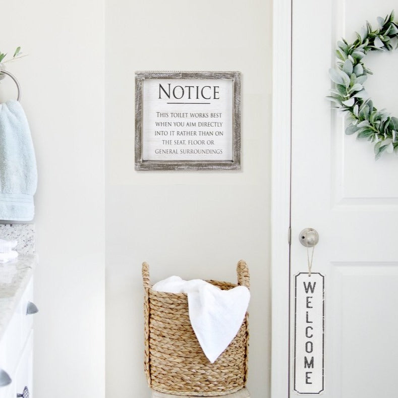 A stylish hanging wood sign displaying the word 'Welcome' in black letters on a white background, perfect for door decoration.