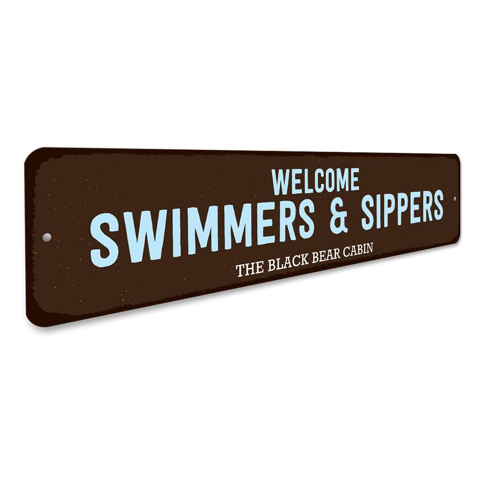 Welcome Swimmers & Sippers Sign made of durable aluminum, featuring a charming design perfect for lakehouses.