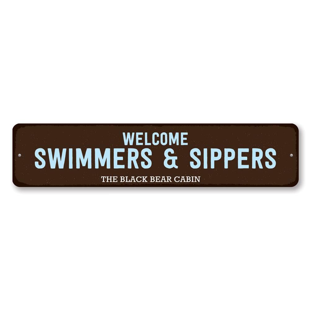 Welcome Swimmers & Sippers Sign made of durable aluminum, featuring a charming design perfect for lakehouses.