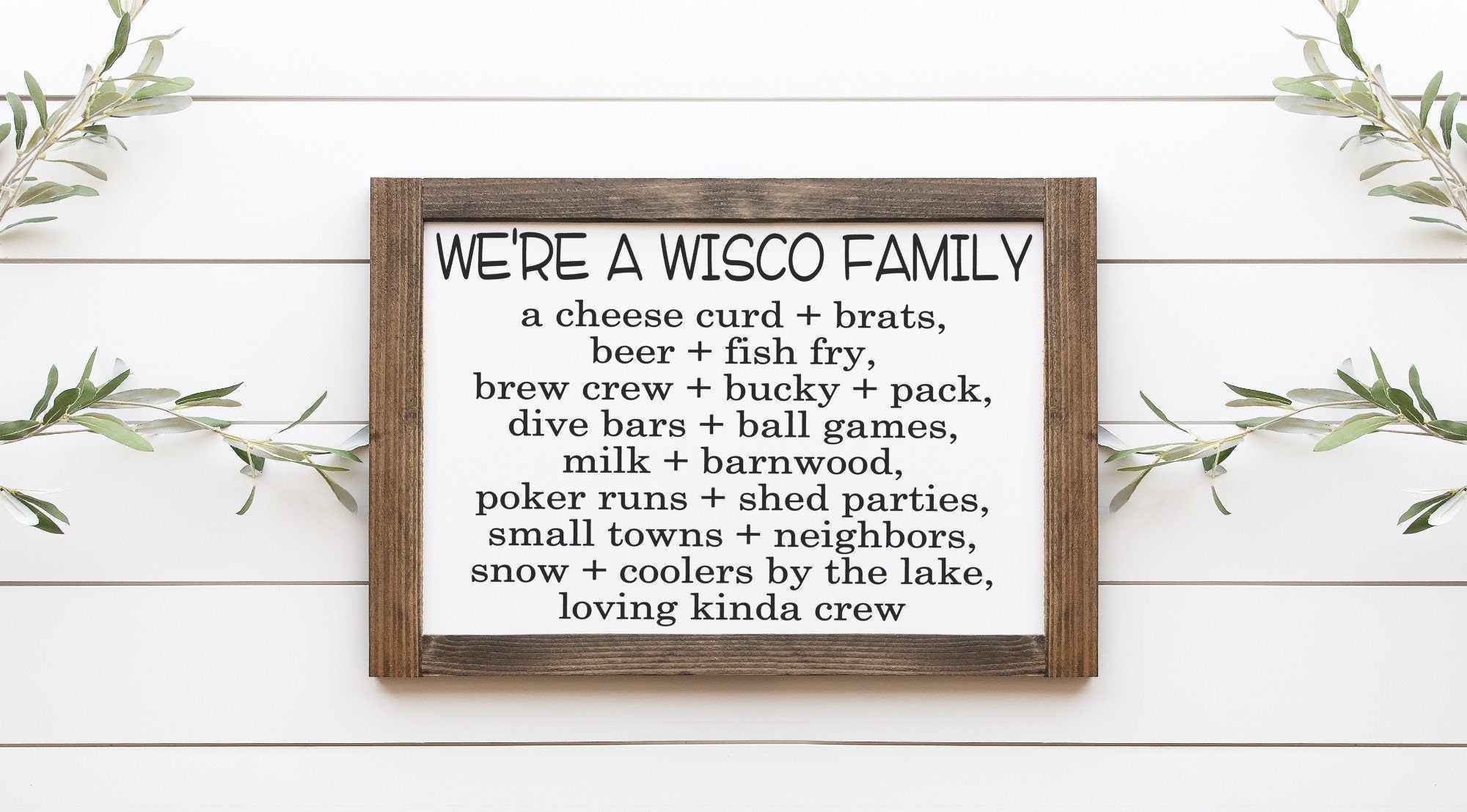 We're A Wisco Family Wood Sign, handcrafted from 100% wood with a matte white background and painted lettering, showcasing rustic charm.