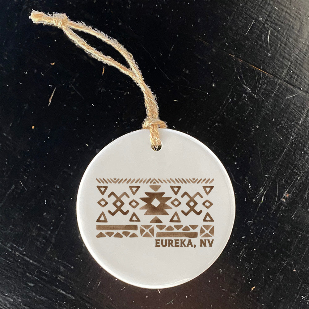 A beautifully crafted porcelain ornament featuring a Western pattern, customizable with city and state, showcasing vibrant colors and a glossy finish.