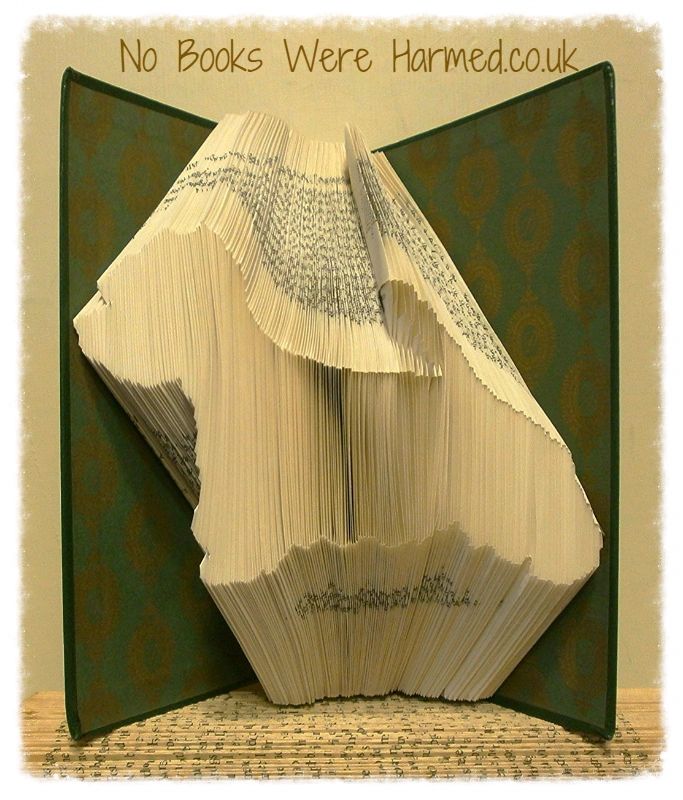 Handcrafted West Highland White Terrier art made from vintage book pages, showcasing intricate folds and unique design.