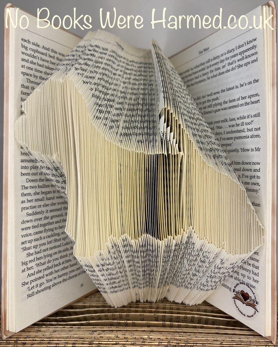 Handcrafted West Highland White Terrier art made from vintage book pages, showcasing intricate folds and unique design.