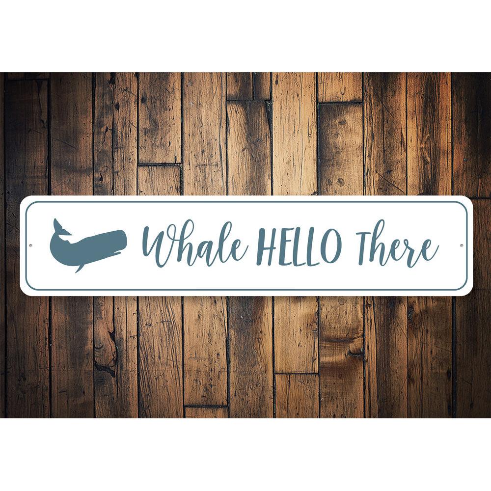 Whale Hello There Sign made of aluminum, featuring a whimsical whale design, perfect for home decor.