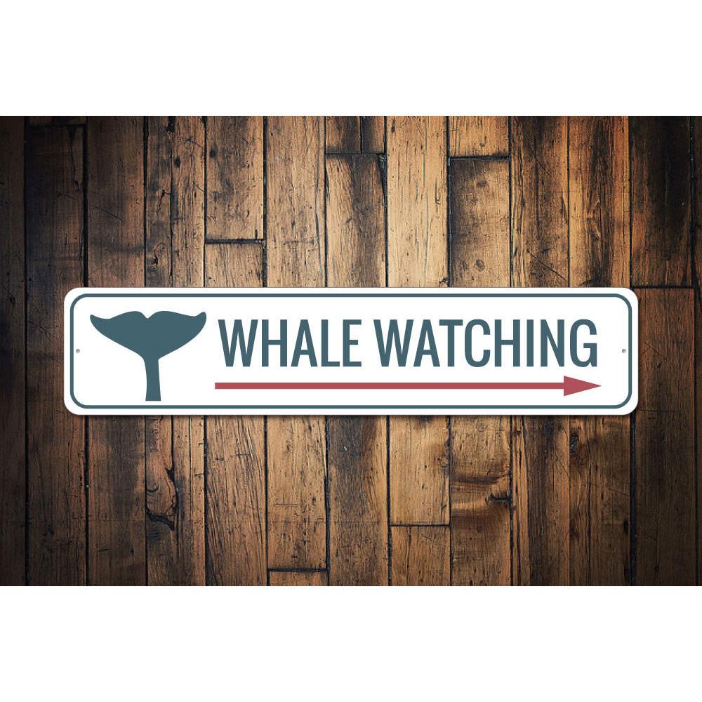 A decorative Whale Watching Sign made of high-quality aluminum, featuring vibrant colors and a coastal theme, perfect for beach houses and restaurants.