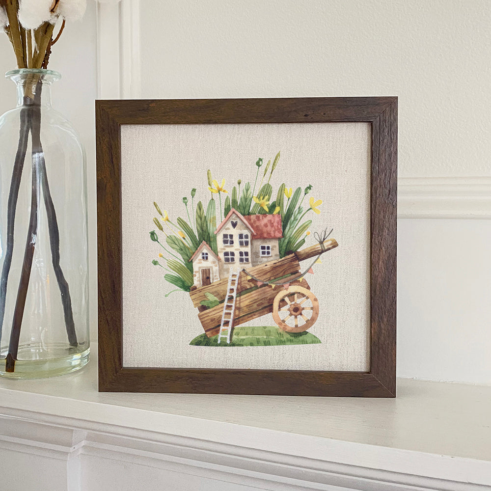 A charming Wheelbarrow Fairy House sign with a stylized wood frame, featuring eco-friendly printing on a linen-look background.