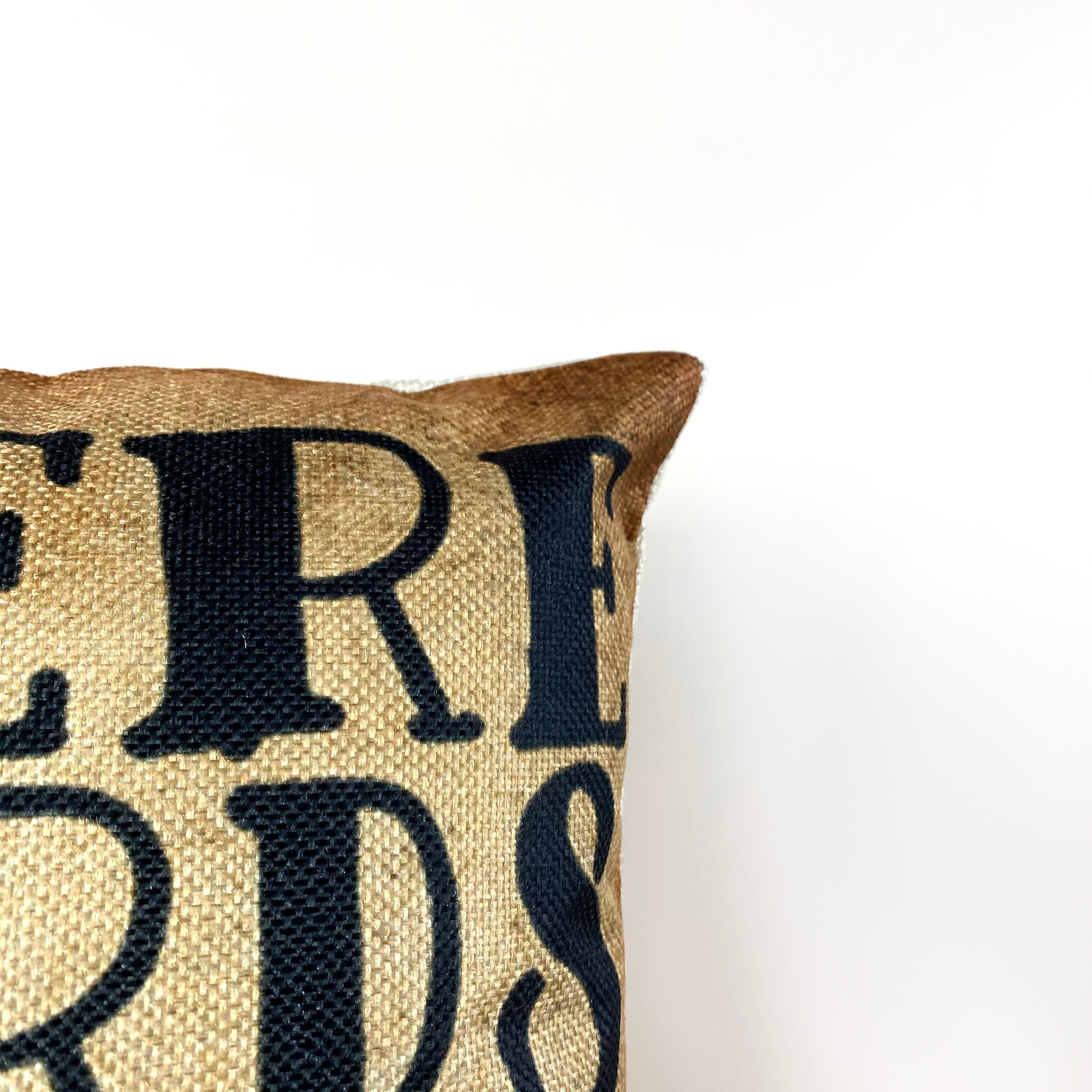 A decorative pillow cover featuring the quote 'Where Words Fail, Music Speaks' in bold letters on a gold background, perfect for music lovers.