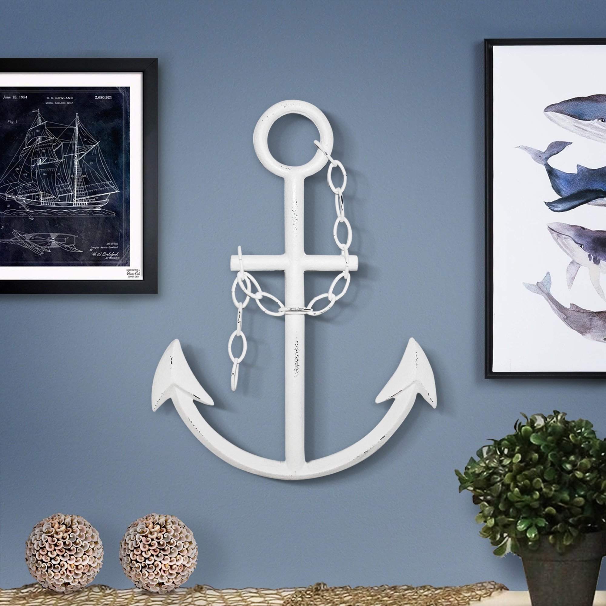 A beautifully hand-painted white cast iron anchor, 16 inches tall and 13 inches wide, perfect for nautical decor.