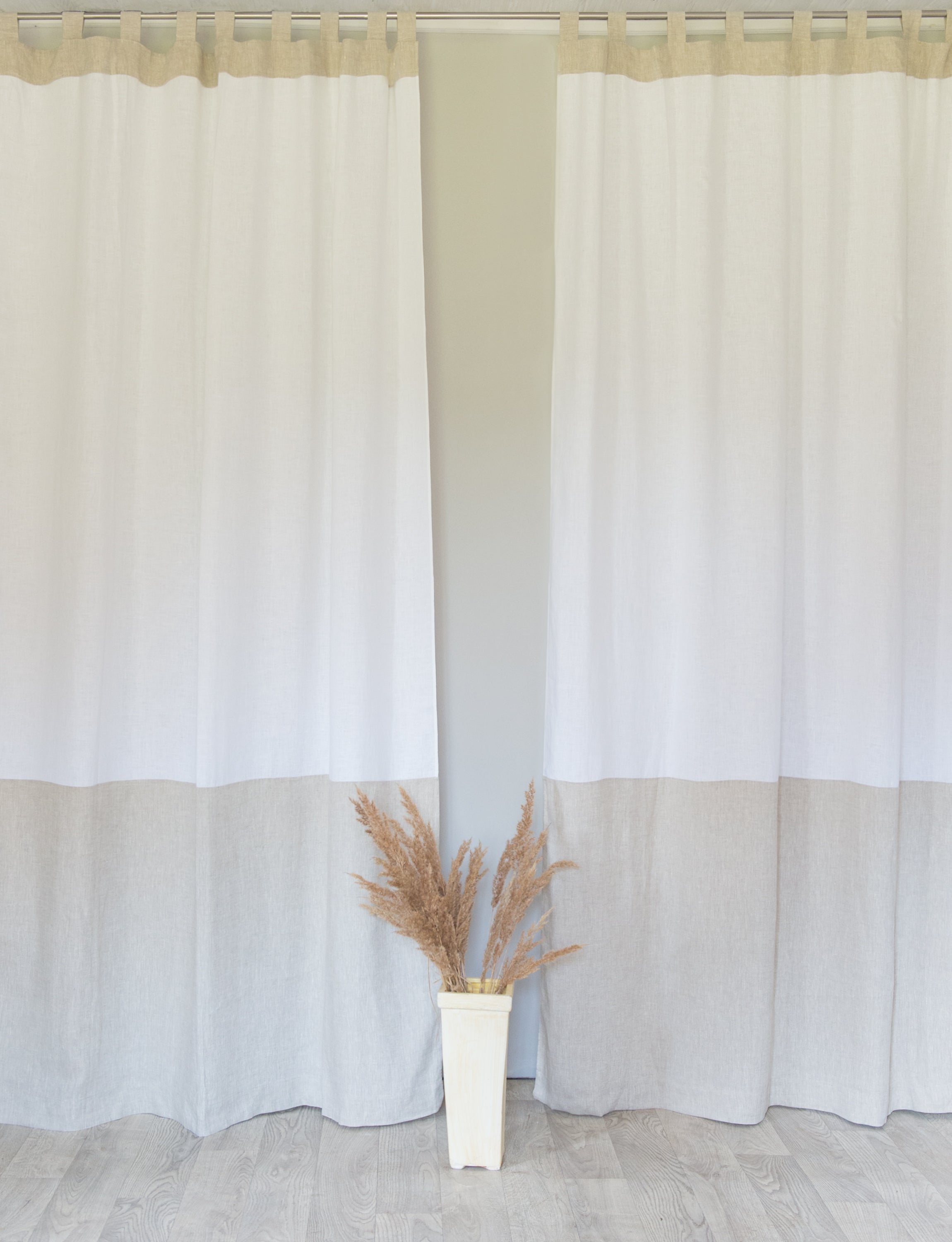 Elegant White and Natural Light linen curtains with tab tops, showcasing a stylish two-tone design for modern interiors.