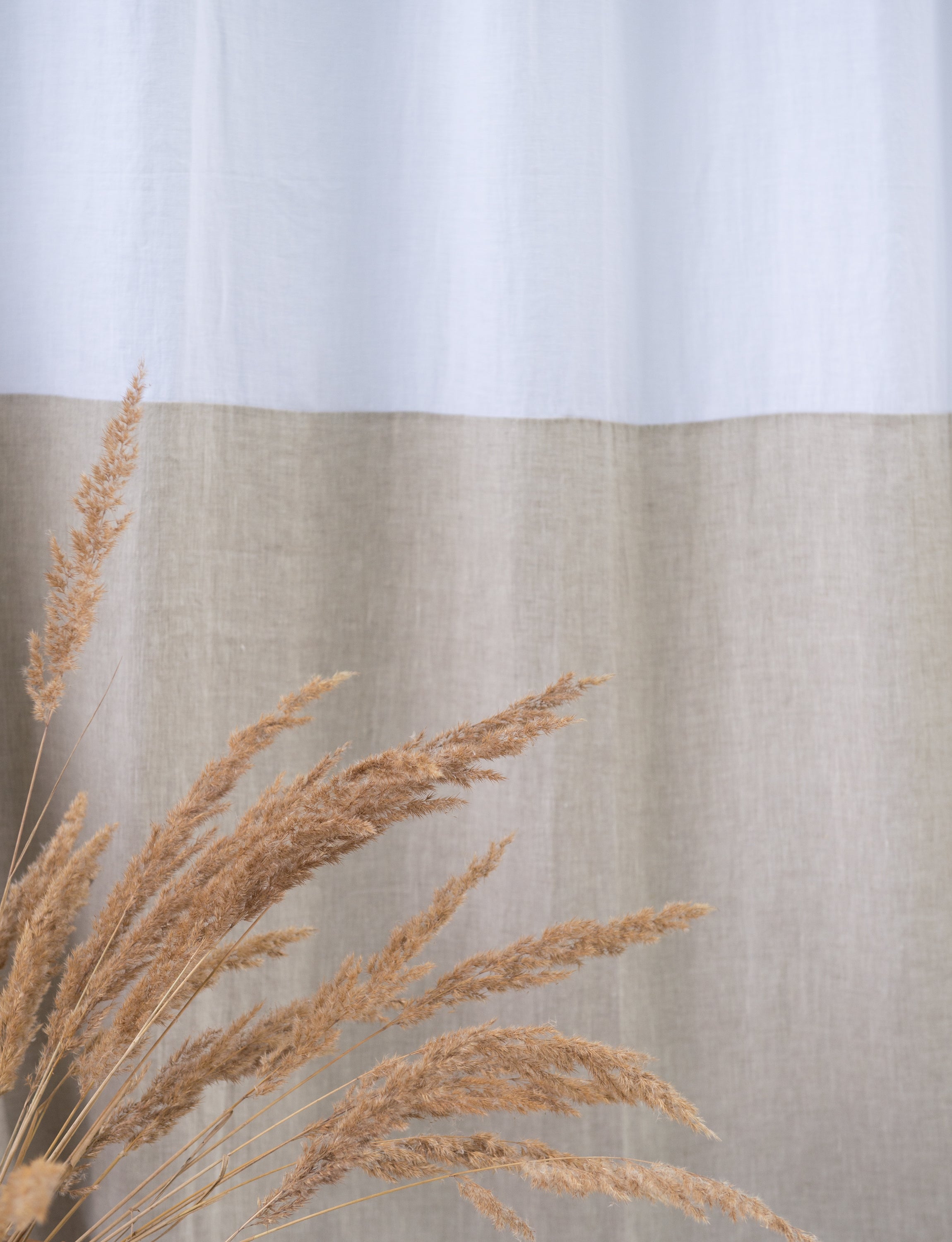 Elegant White and Natural Light linen curtains with tab tops, showcasing a stylish two-tone design for modern interiors.