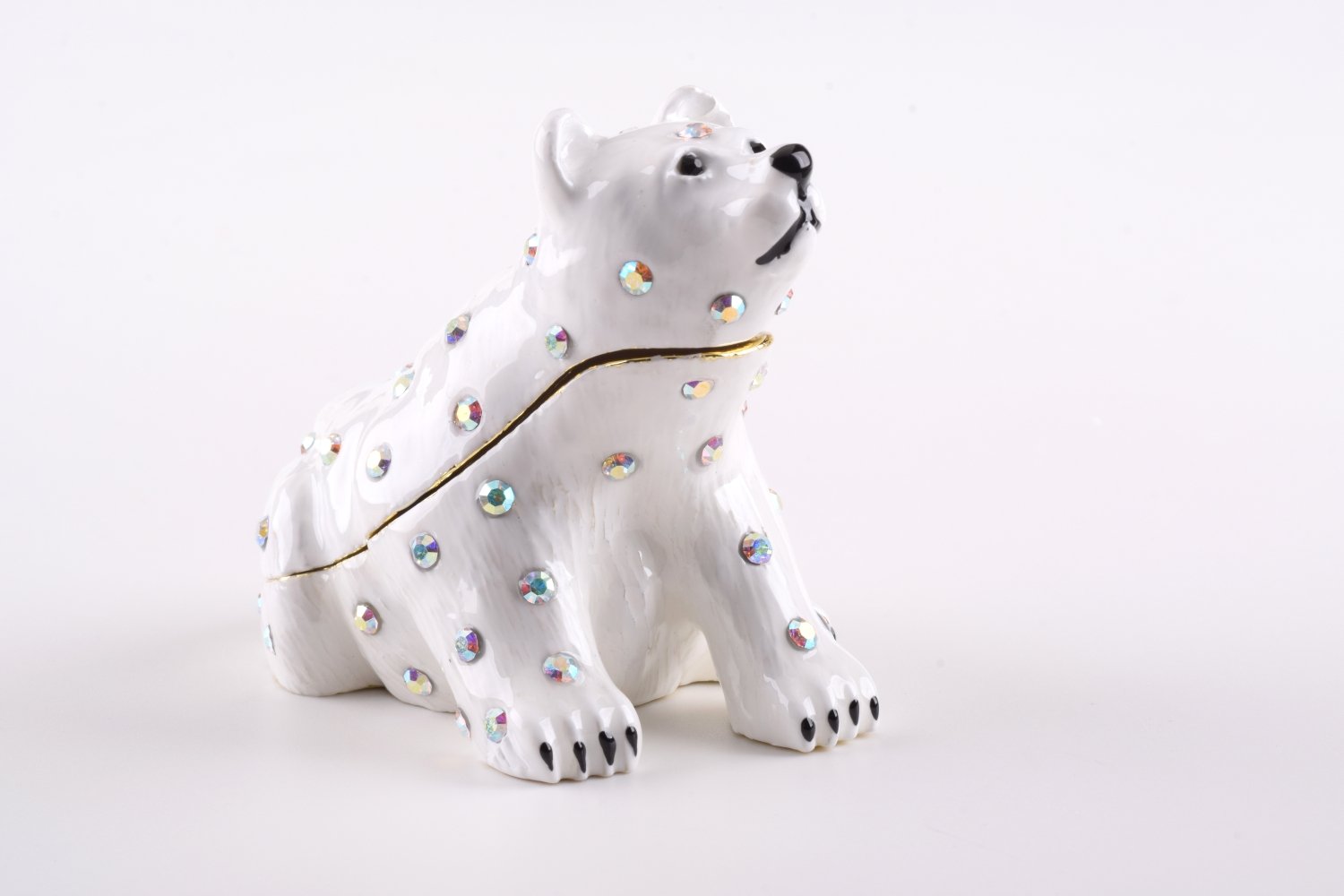 A beautifully handcrafted White Bear trinket box adorned with Austrian crystals and plated with 24K gold, showcasing intricate details and a secure magnetic closure.