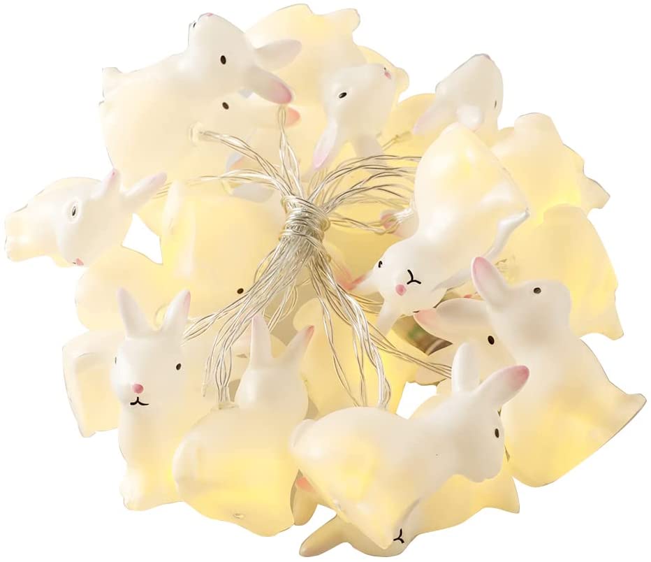 A string of 20 LED bunny-shaped lights on a transparent wire, glowing warmly, perfect for indoor decoration.