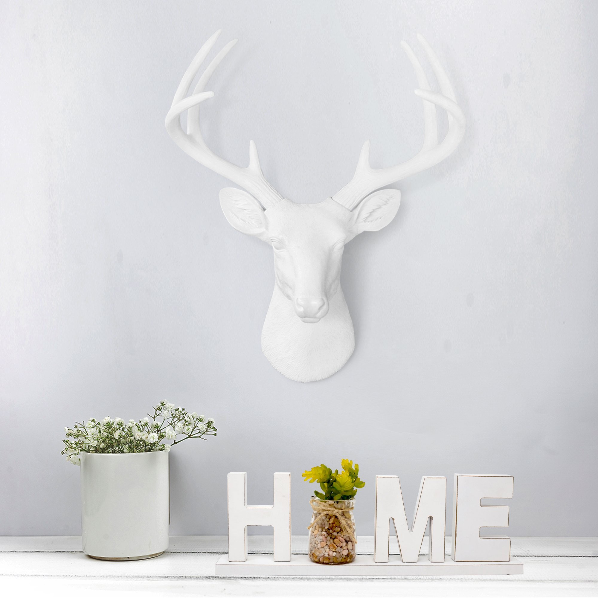 Stylish 21-inch white faux deer head wall decor with antlers, crafted from eco-friendly resin.