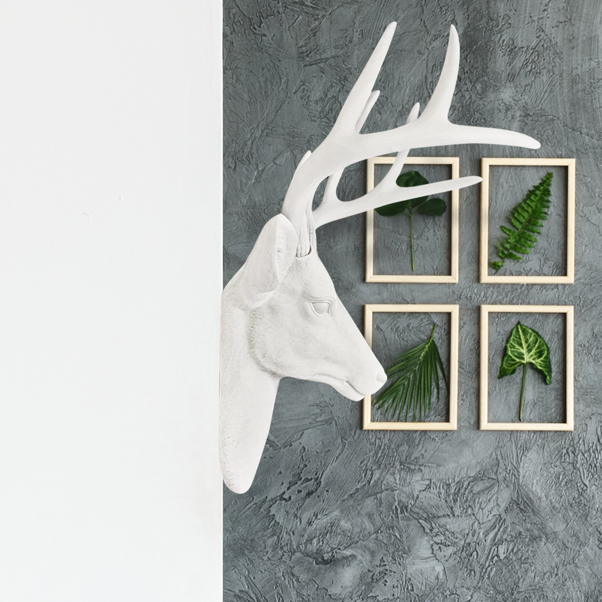 Stylish 21-inch white faux deer head wall decor with antlers, crafted from eco-friendly resin.