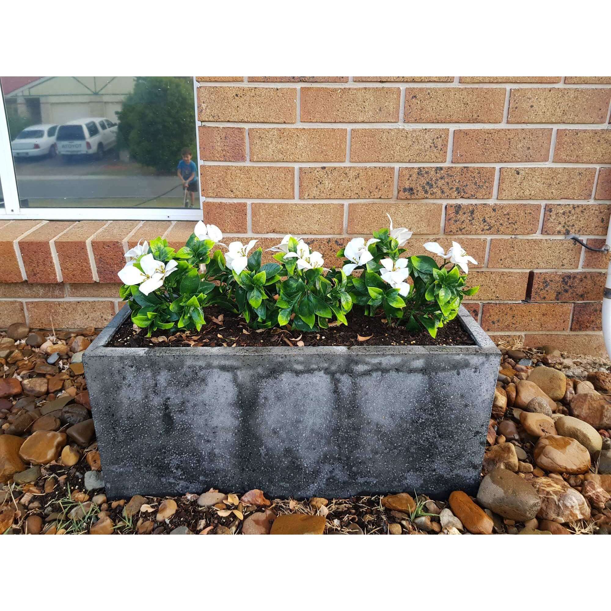 A 30cm long White Flowering Jasmine Artificial Stem with realistic white petals, perfect for indoor and outdoor decor.