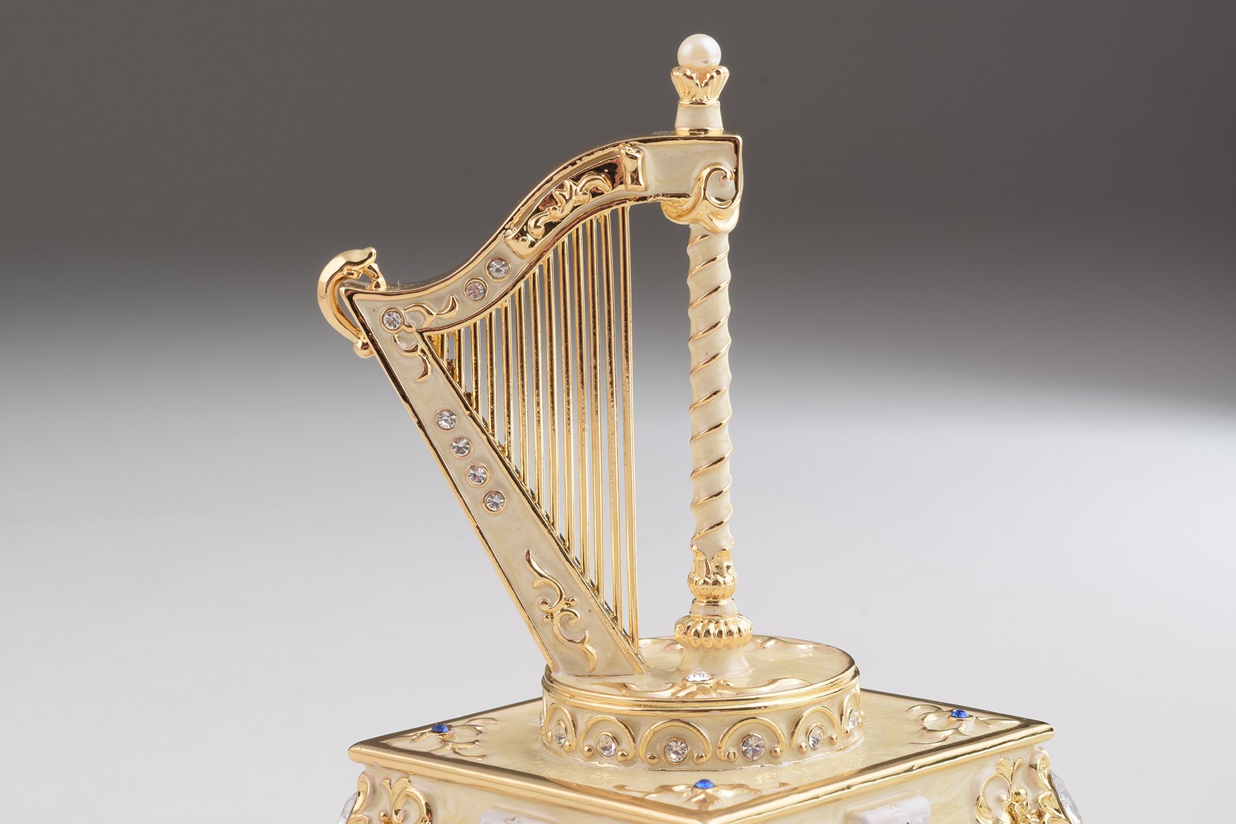 Elegant White Harp trinket box with enamel painting and Austrian crystals, showcasing intricate craftsmanship and luxurious gold or silver plating.