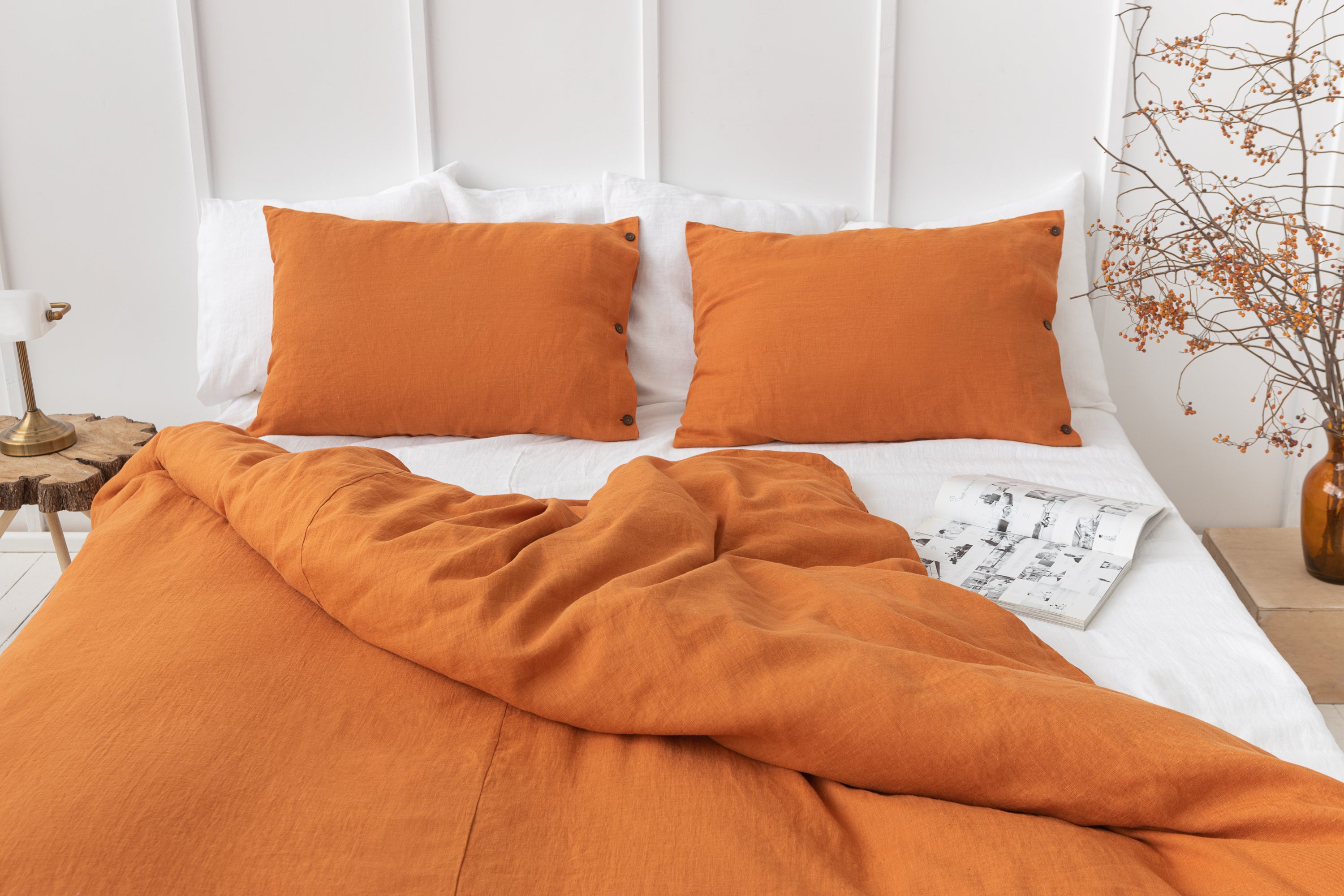 A luxurious white linen duvet cover featuring coconut buttons, showcasing its soft texture and elegant design.