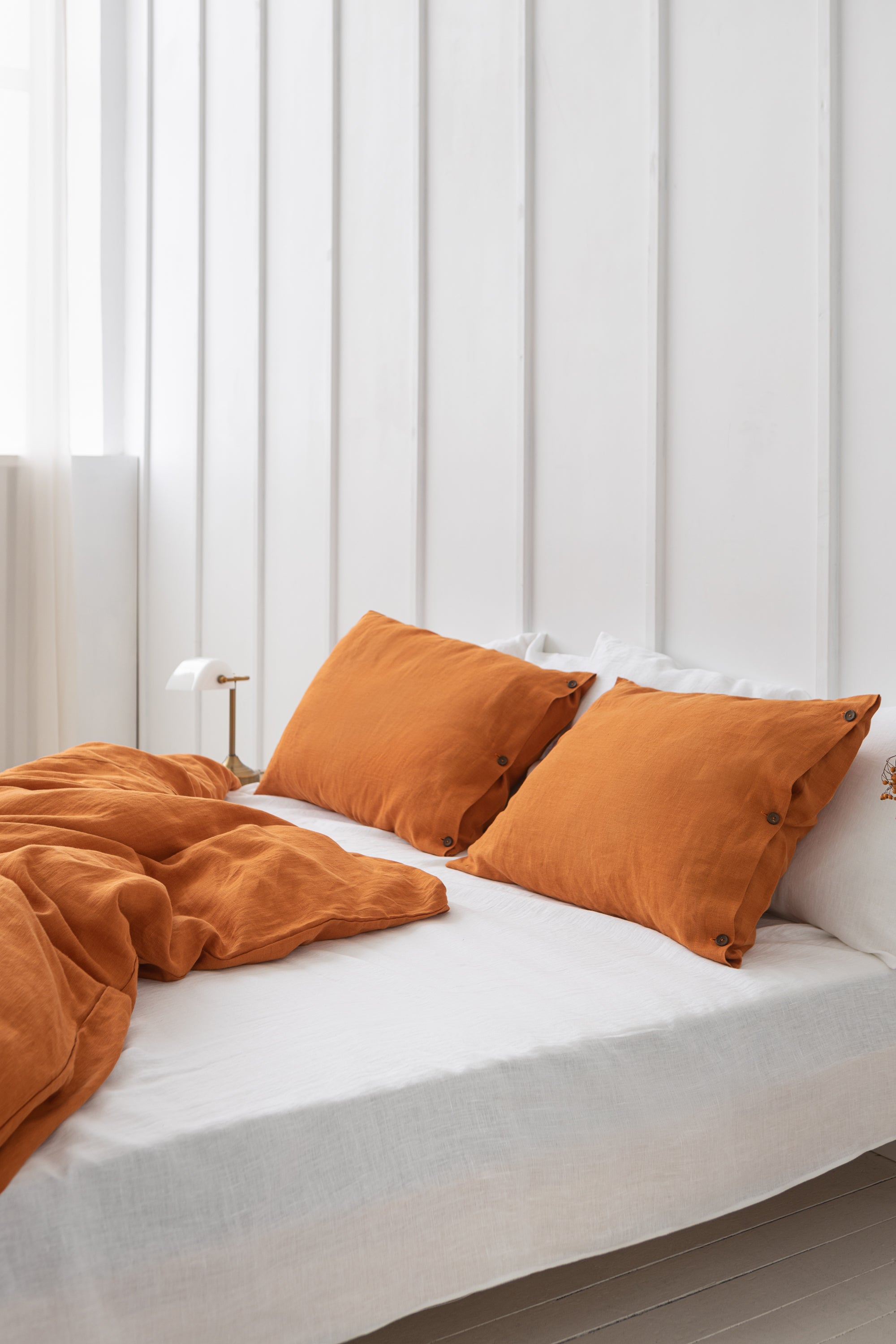 A luxurious white linen flat bedsheet made from 100% natural linen, showcasing its soft texture and elegant simplicity.