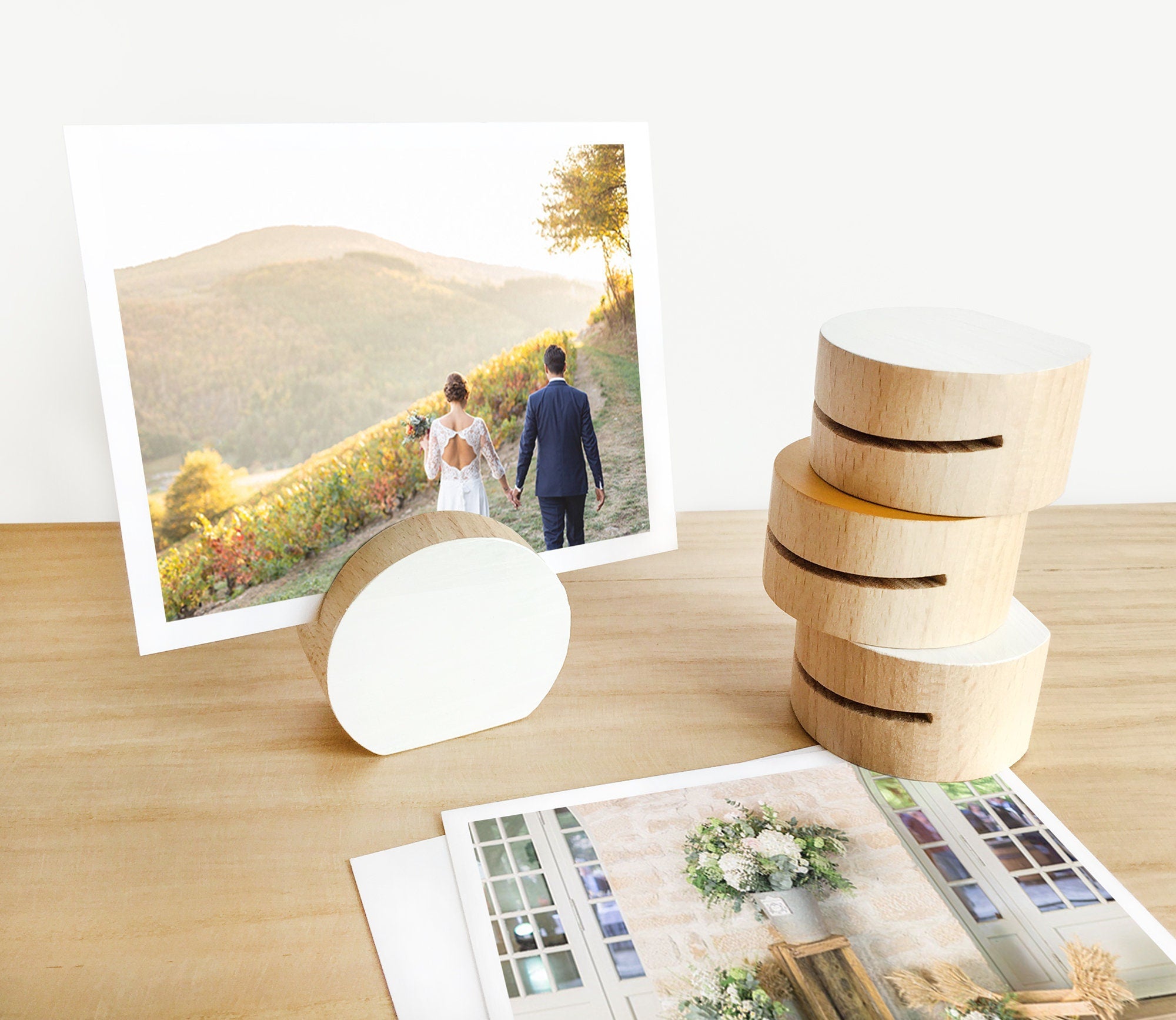 A handcrafted white moon card holder made from eco-friendly wood, designed to hold photos and art prints elegantly.