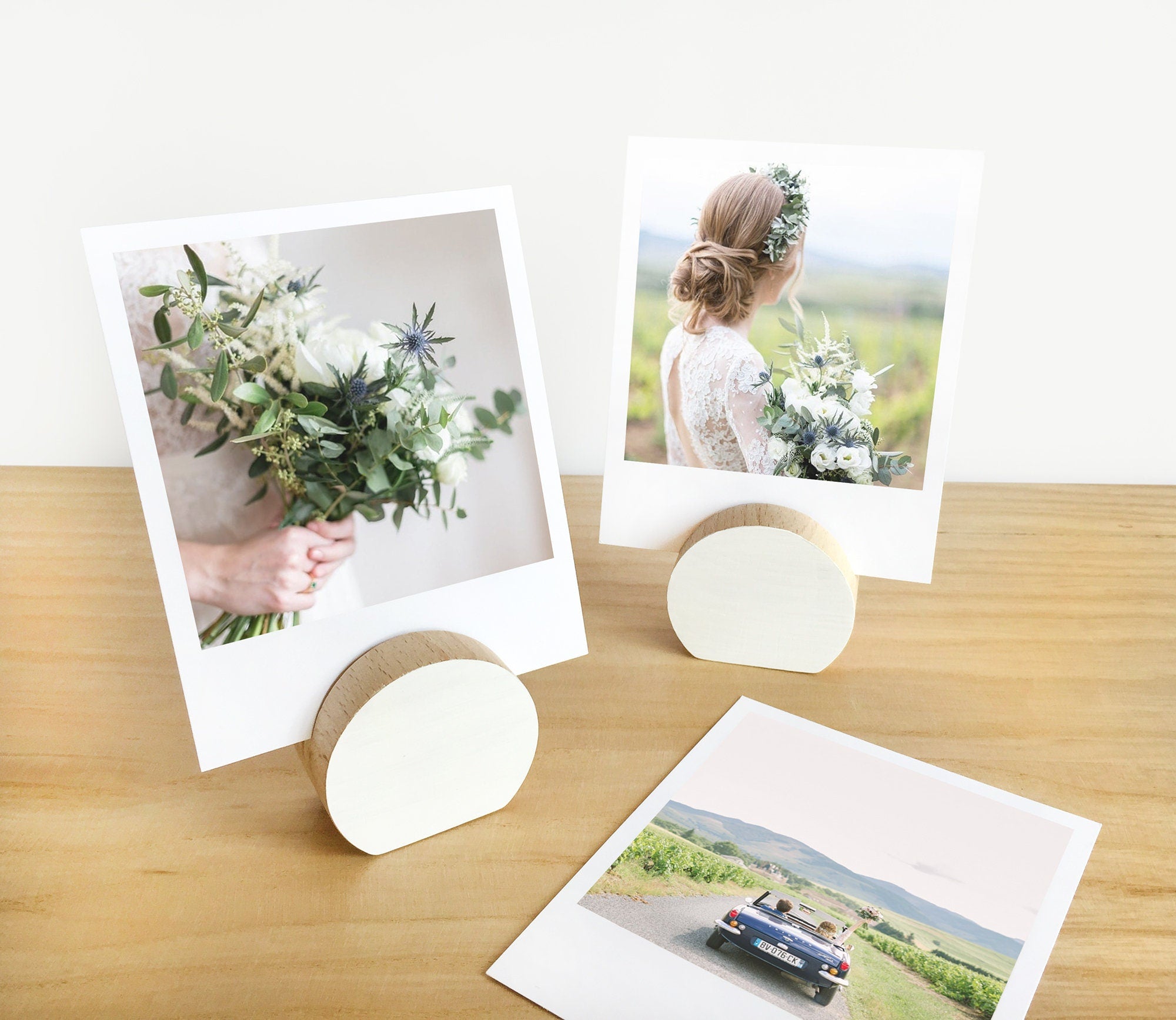 A handcrafted white moon card holder made from eco-friendly wood, designed to hold photos and art prints elegantly.