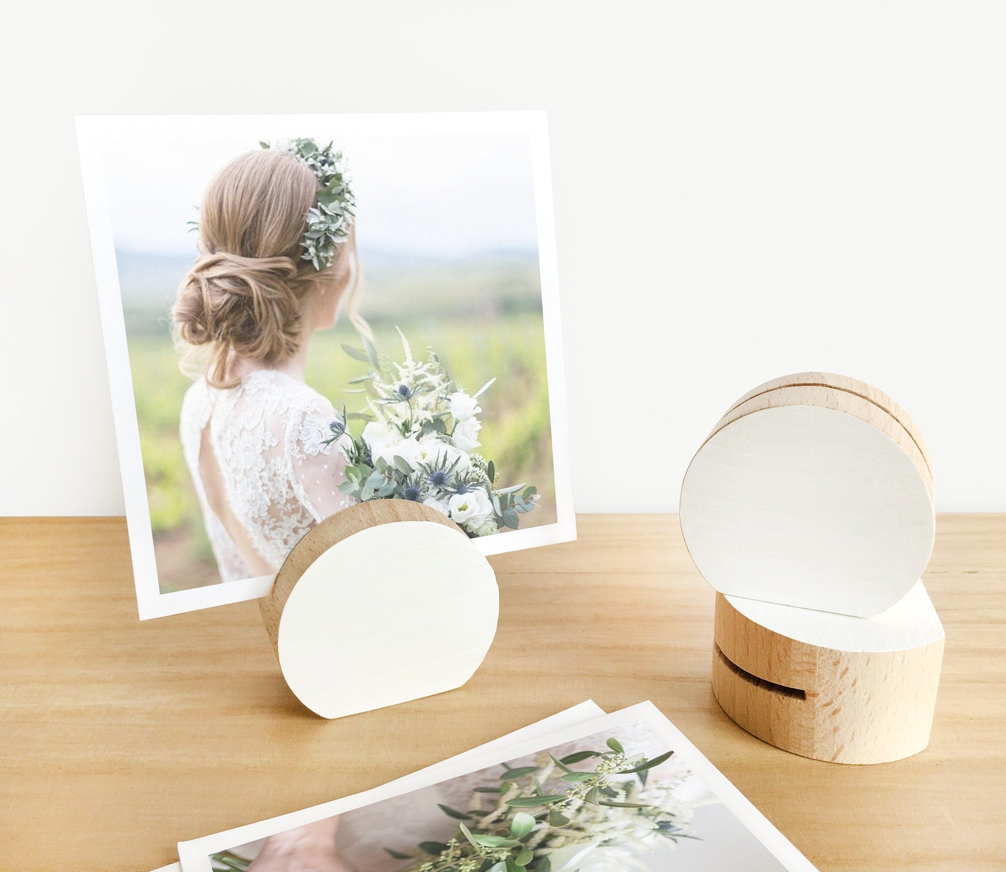 A handcrafted white moon card holder made from eco-friendly wood, designed to hold photos and art prints elegantly.